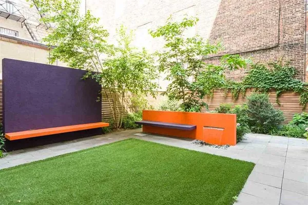 a view of a yard with a bench