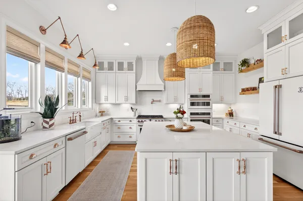 a spacious bedroom with a bed and a flat screen tv