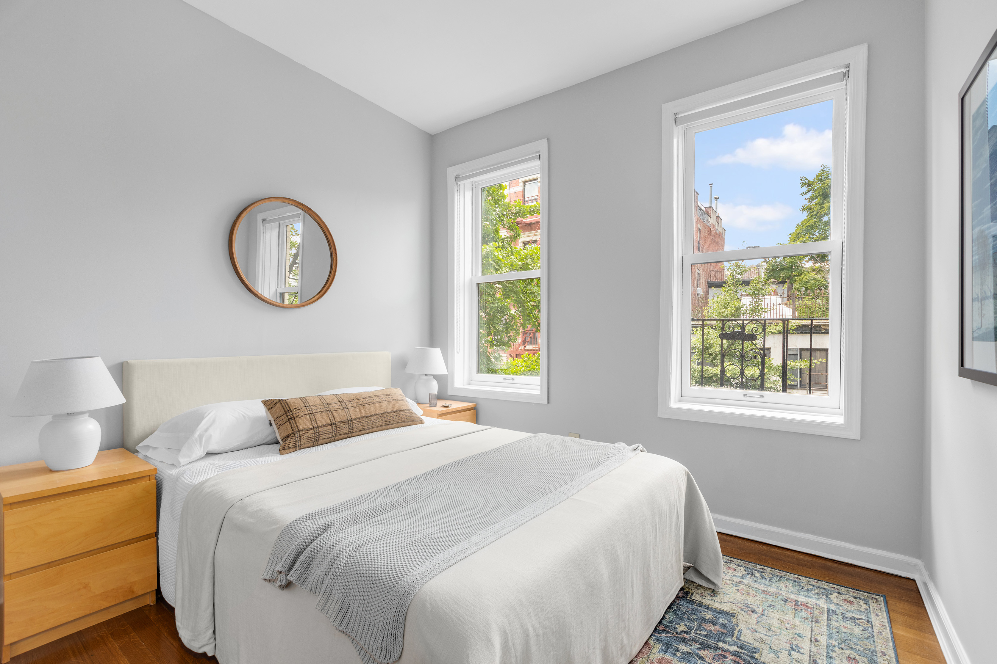 92 Perry Street, Unit 6 Manhattan, NY 10014 - Photo 2 of 10 a bedroom with a bed and a window