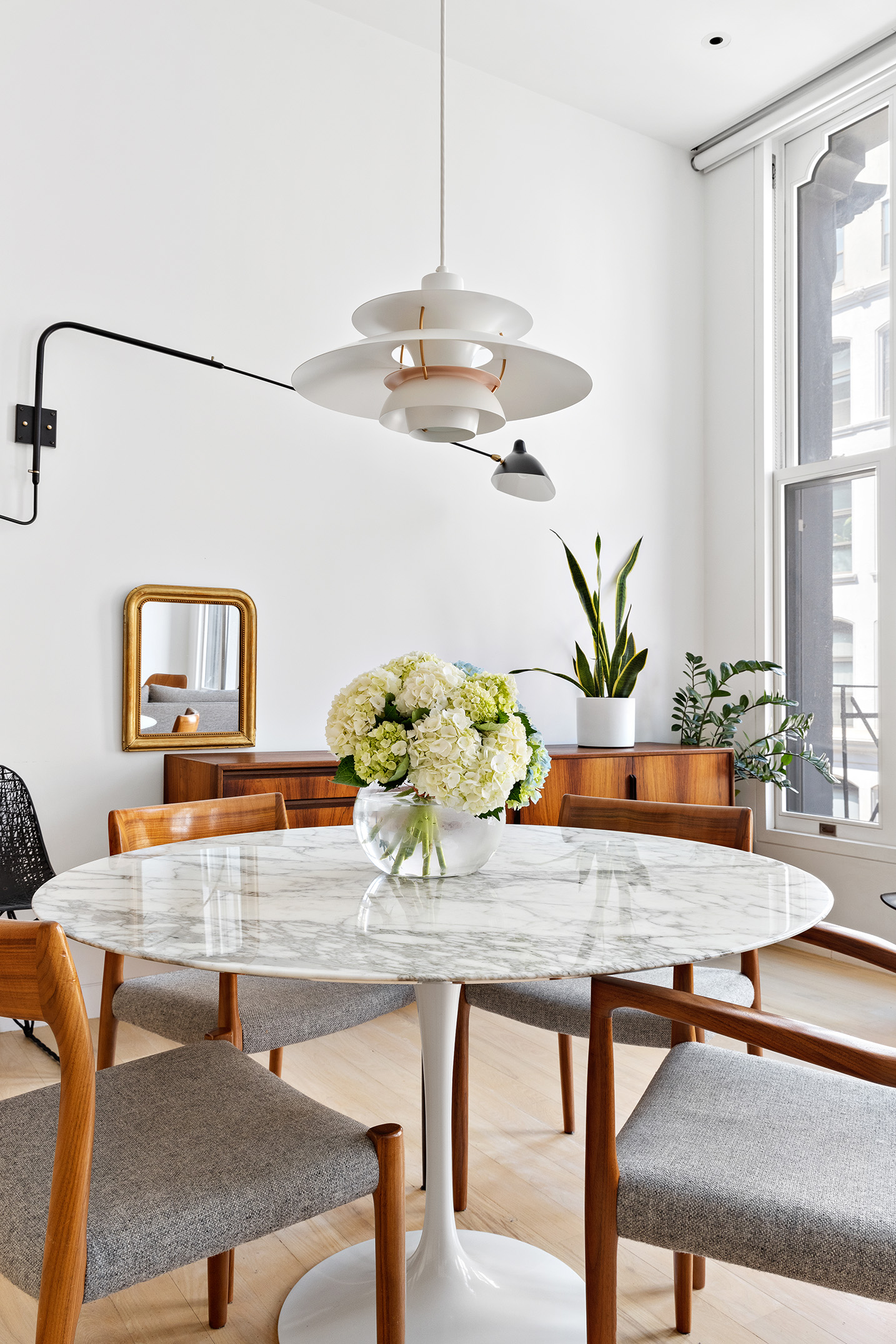 93 Reade Street, Unit 3 Manhattan, NY 10013 - Photo 5 of 12 a dining room with furniture a chandelier and wooden floor