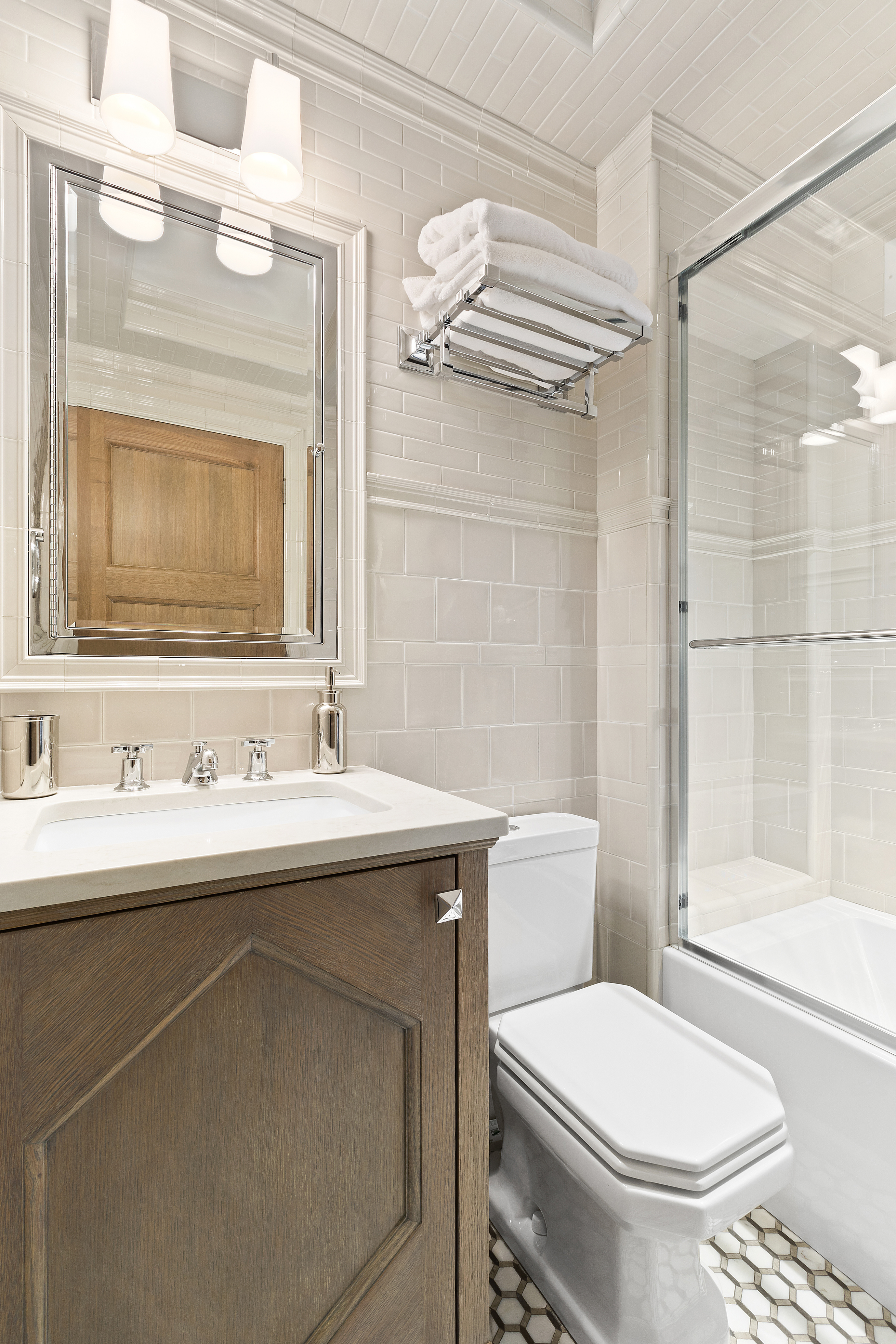 15 West 81st Street, Unit 4E Manhattan, NY 10024 - Photo 12 of 18 a bathroom with a sink a toilet and shower