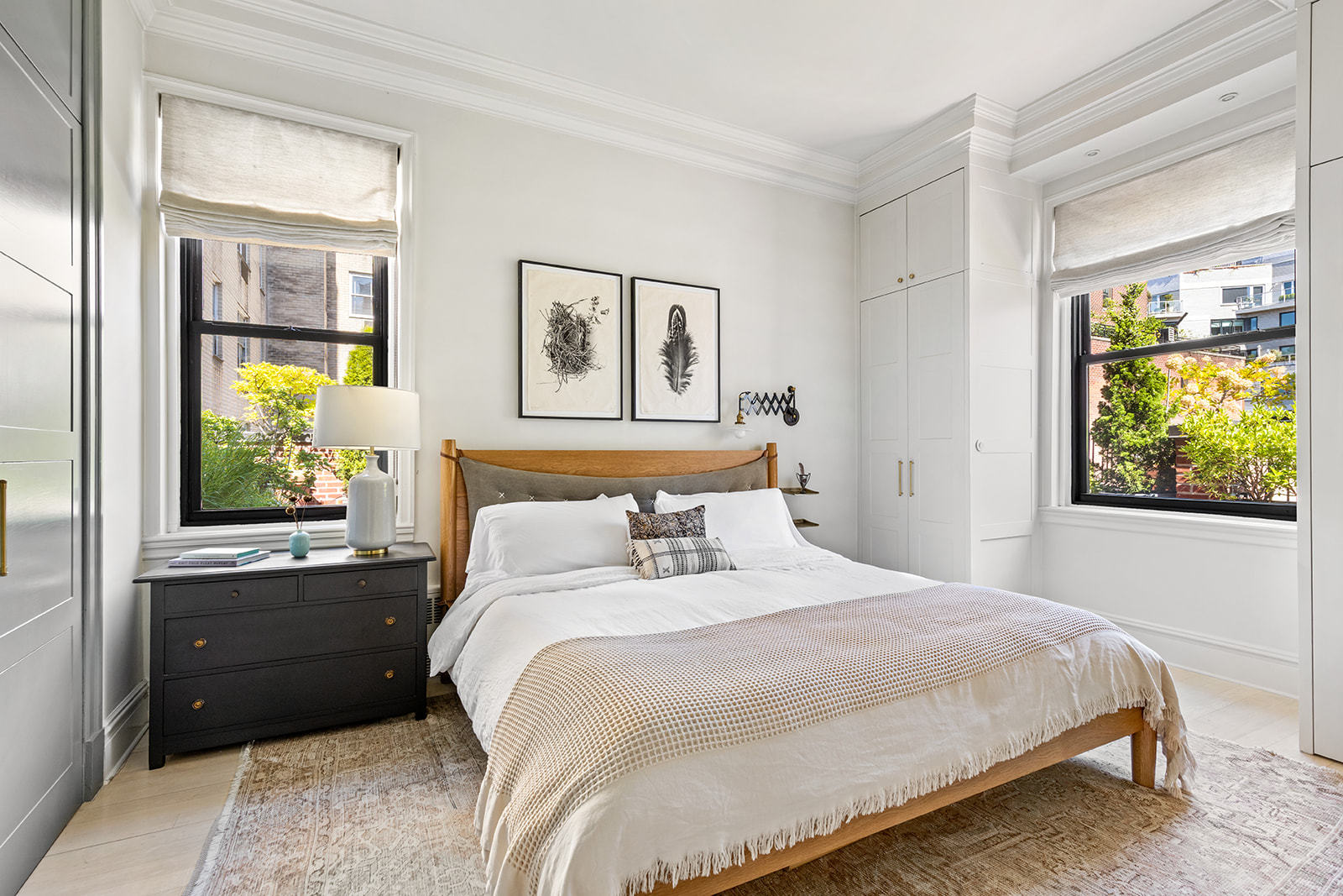 151 East 83rd Street, Unit PHB Manhattan, NY 10028 - Photo 4 of 11 a bedroom with a bed and a window