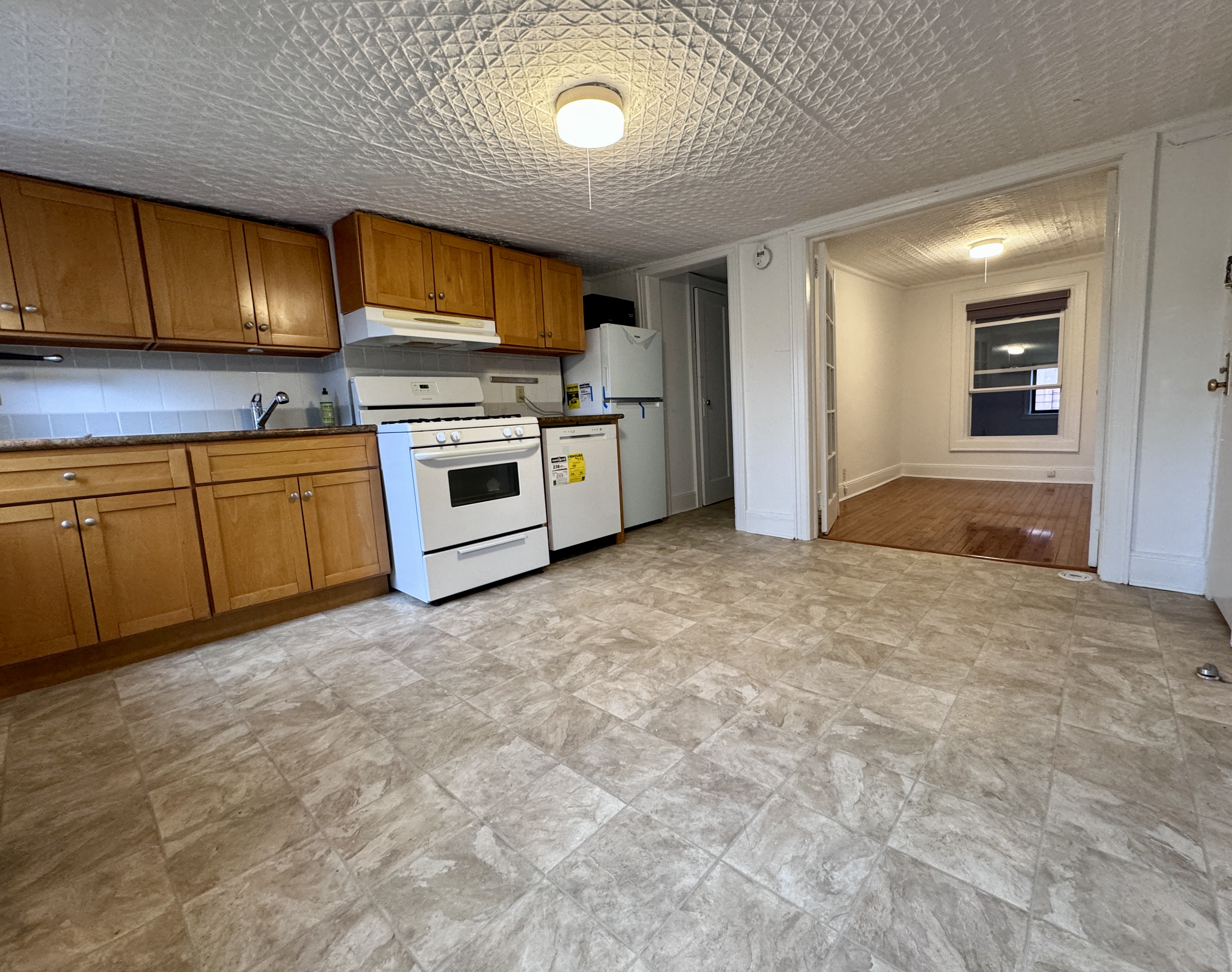 195 Court Street, Unit 4 Brooklyn, NY 11201 - Photo 5 of 11 a kitchen with stainless steel appliances granite countertop a stove cabinets and a sink