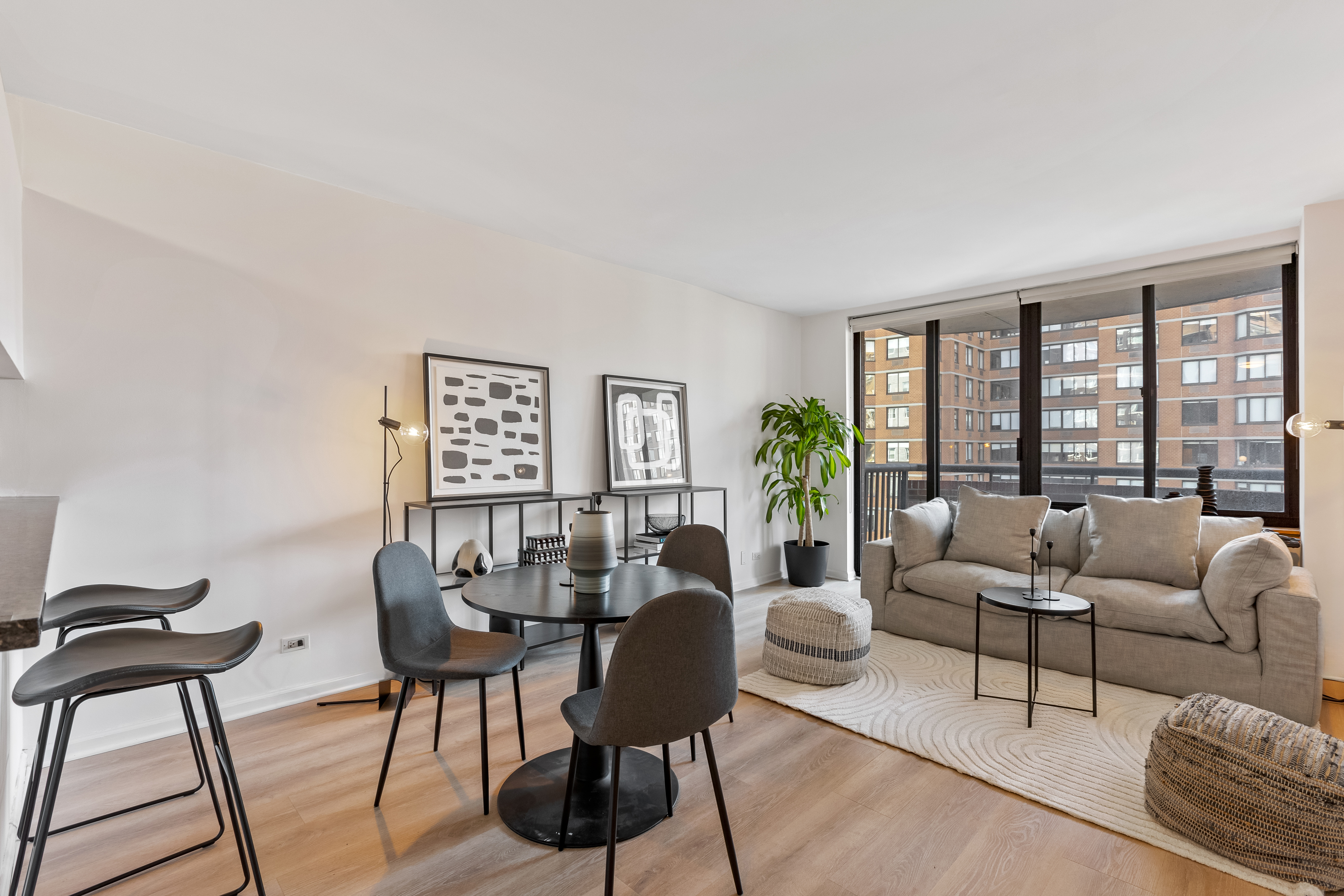 157 East 32nd Street, Unit 8A Manhattan, NY 10016 - Photo 2 of 16 a living room with furniture and a large window