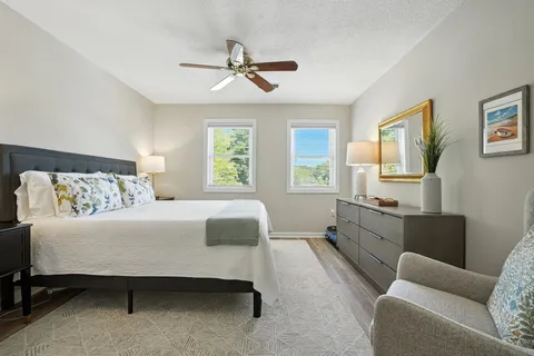 a bedroom with a bed and window