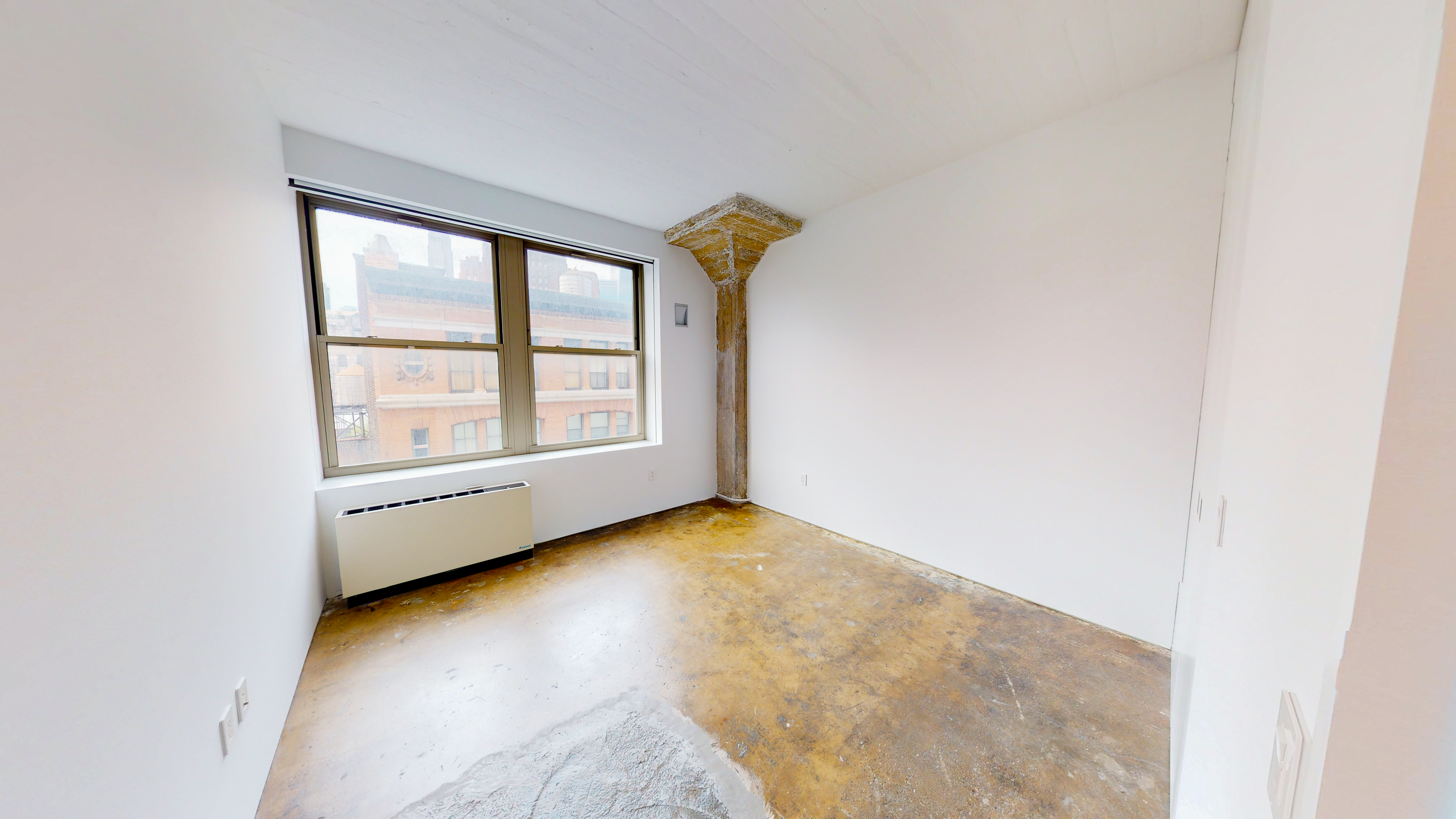 25 North Moore Street, Unit 10B Manhattan, NY 10013 - Photo 4 of 15 a view of an empty room with a window