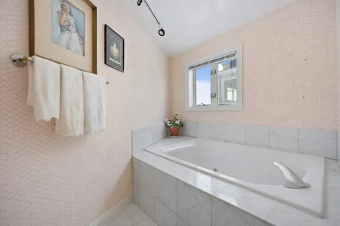 a bedroom with a bed and a table