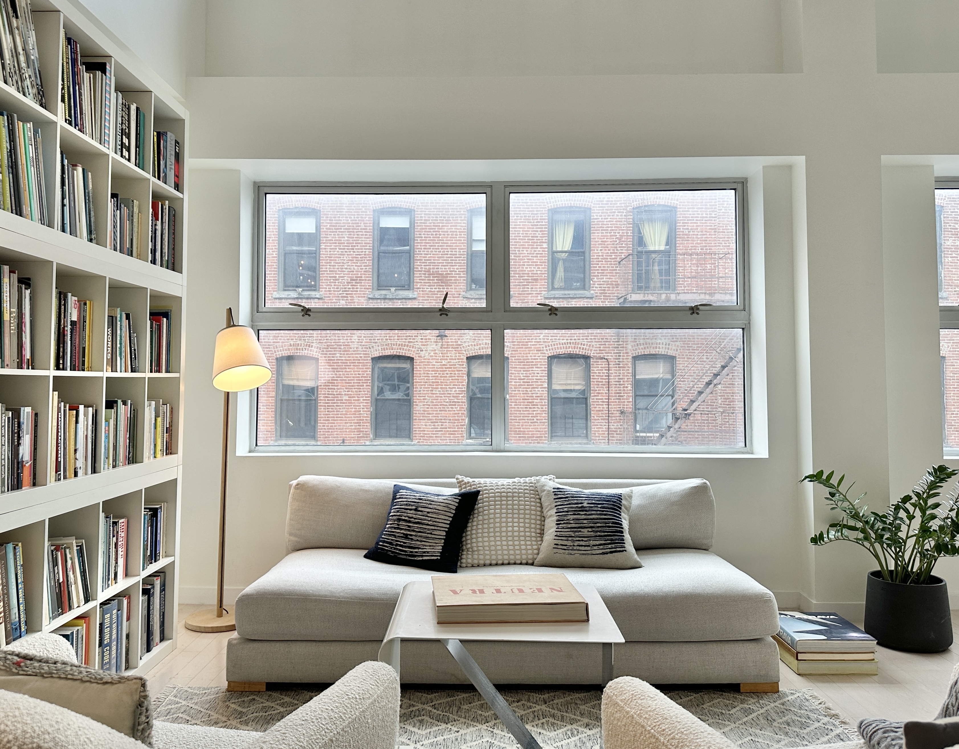 100 North 3rd Street, Unit 3E Brooklyn, NY 11249 - Photo 4 of 15 a living room with furniture and a book shelf