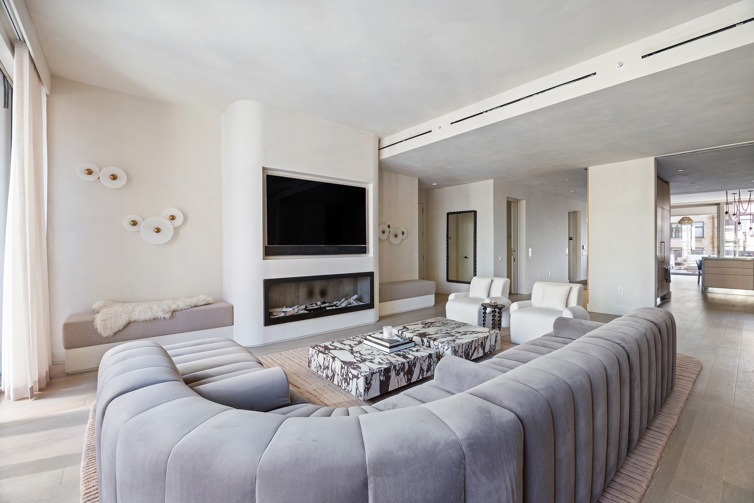 1 Great Jones Alley, Unit 10 Manhattan, NY 10012 - Photo 3 of 41 a living room with fireplace furniture and a flat screen tv