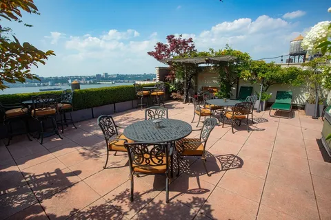 a view of a backyard with sitting area
