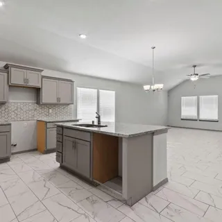 a large kitchen with cabinets