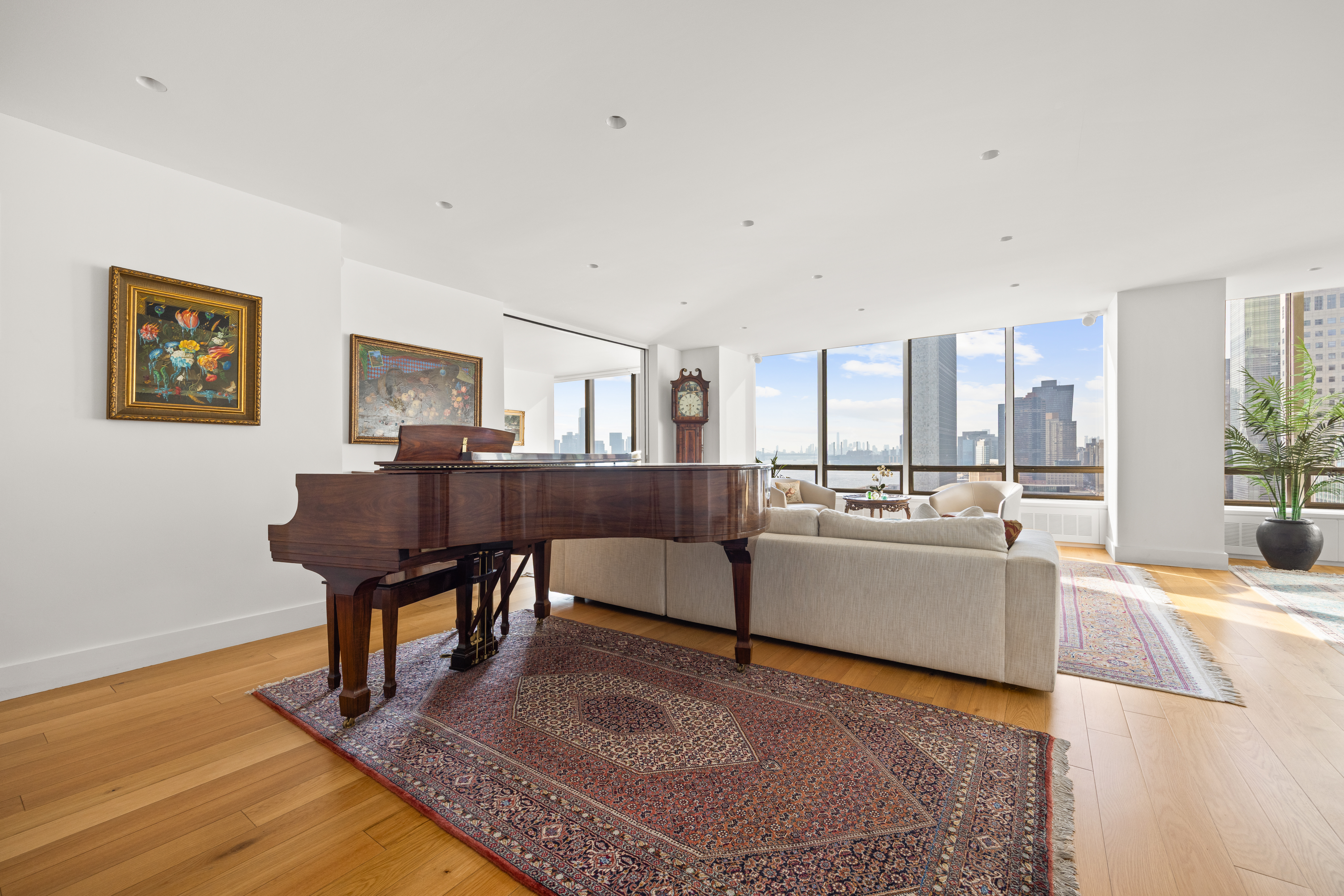 860 United Nations Plaza, Unit 16G Manhattan, NY 10017 - Photo 5 of 12 a living room with furniture and a table