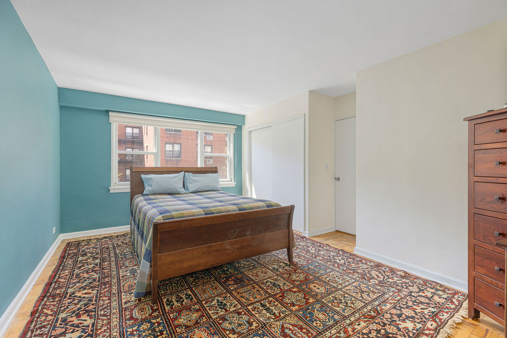 101 West 12th Street, Unit 5V Manhattan, NY 10011 - Photo 13 of 26 a room with a bed and a window