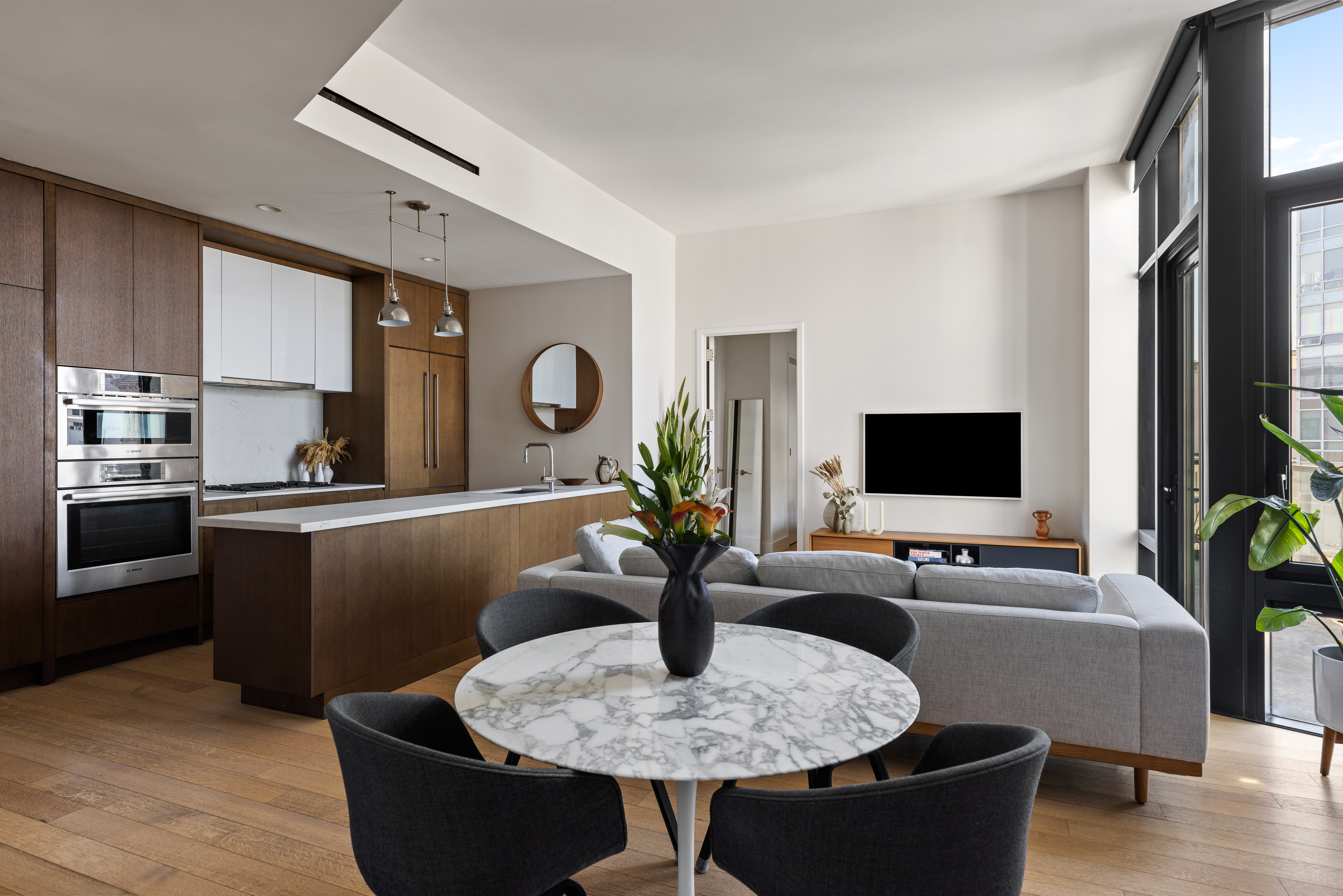 500 Waverly Avenue, Unit PH5 Brooklyn, NY 11238 - Photo 2 of 12 a living room with furniture and a flat screen tv