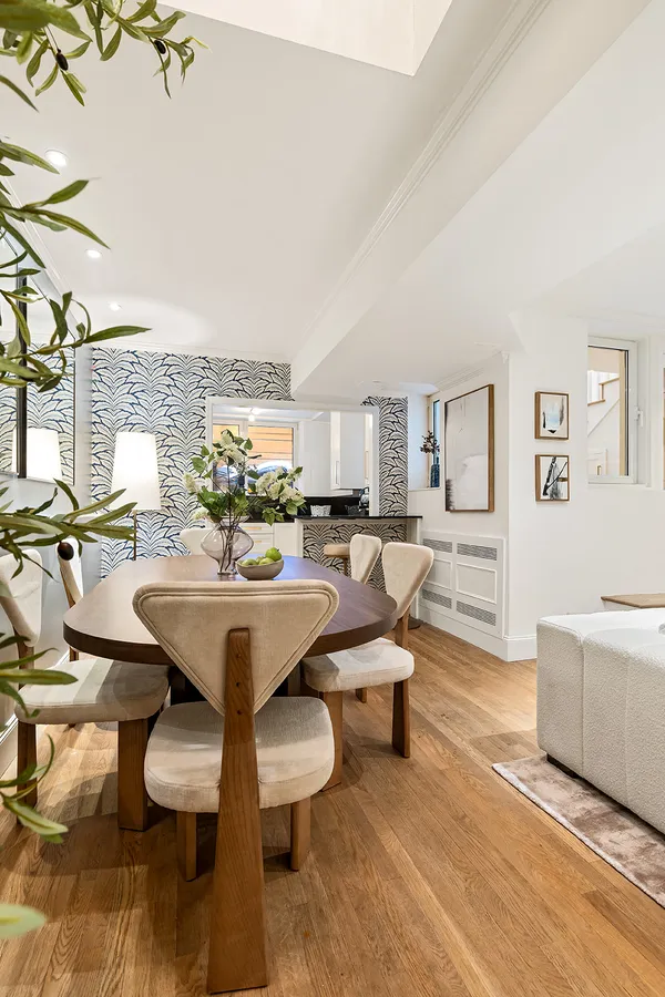 a view of a living room and dining room