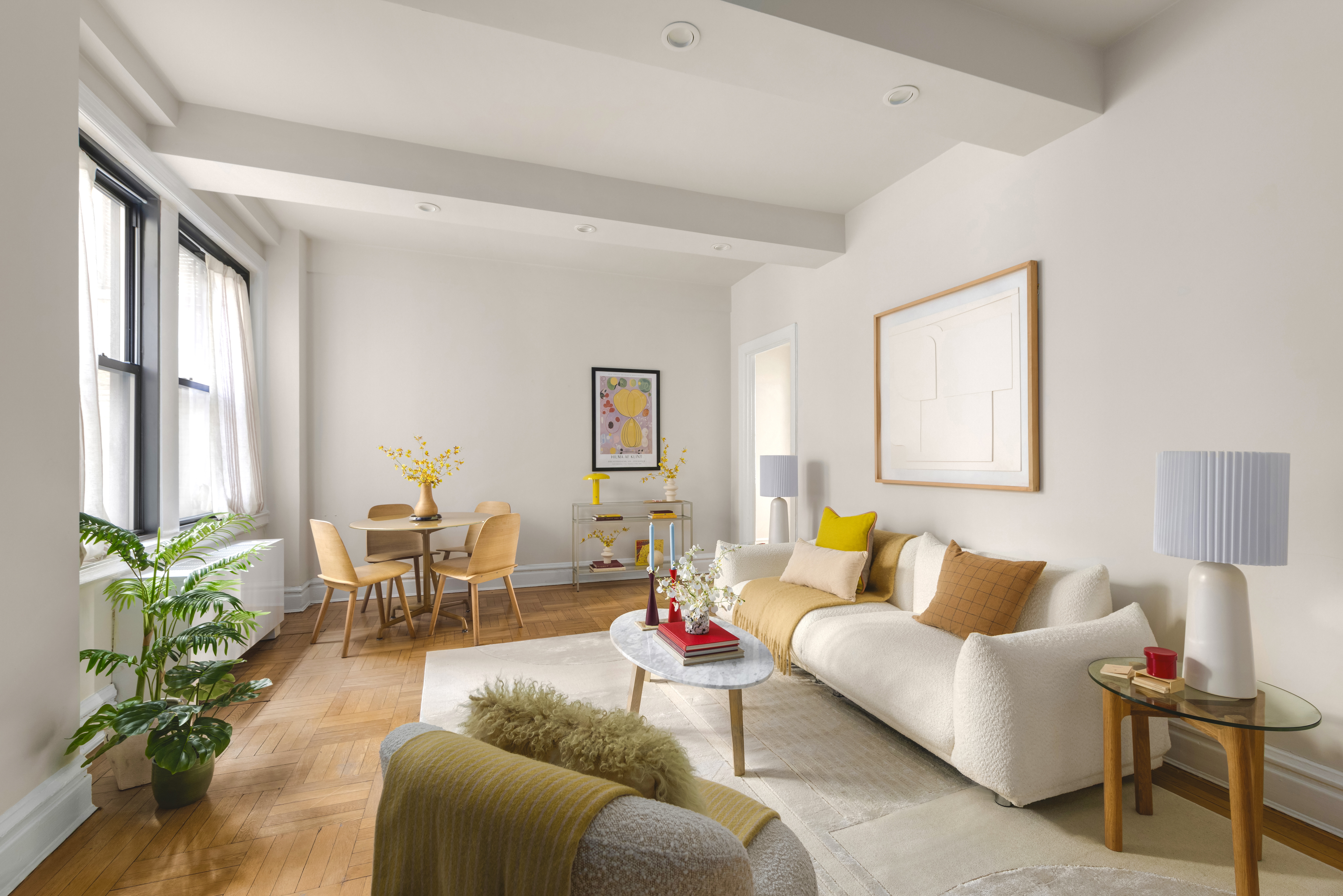 115 East 90th Street, Unit 4E Manhattan, NY 10128 - Photo 2 of 9 a living room with furniture and a lamp