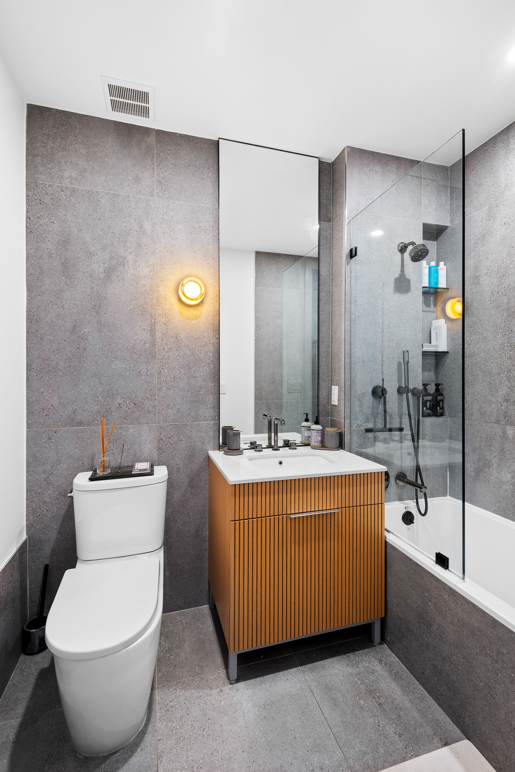 183 Mc Guinness Boulevard, Unit 6C Brooklyn, NY 11222 - Photo 7 of 12 a bathroom with a sink toilet and shower