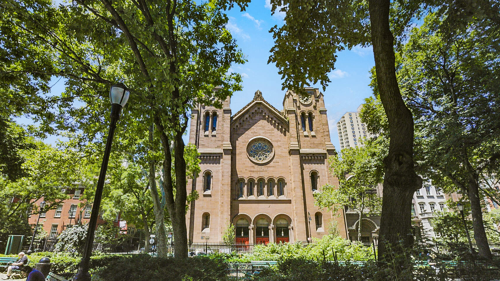 237 East 17th Street, Unit 520 Manhattan, NY 10003 - Photo 12 of 14 a view of a brick house with large windows and a tree