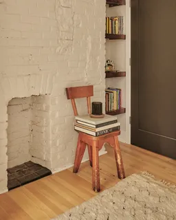 a bedroom with a bed and a table in it