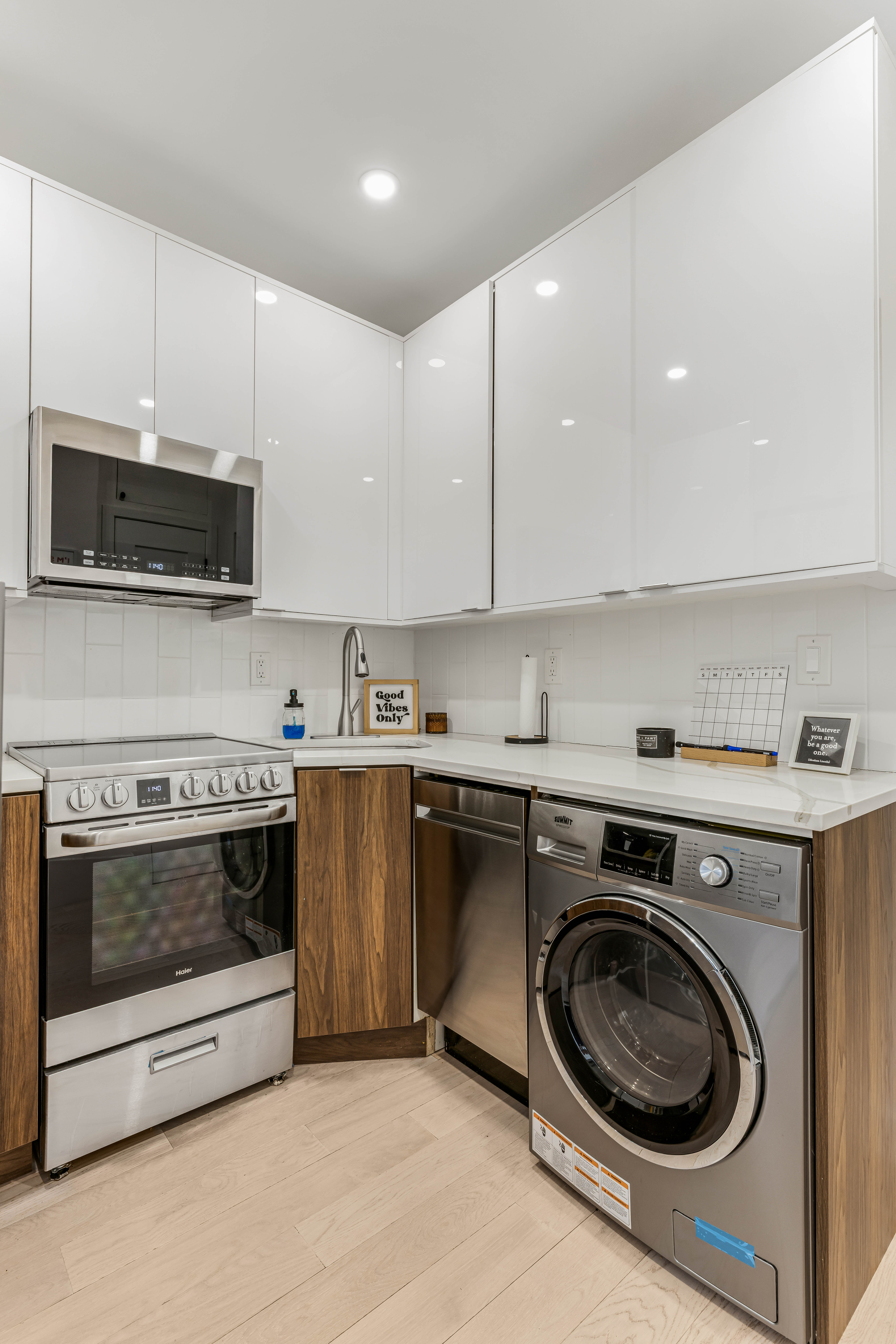 501 1/2 East 83rd Street, Unit 5E Manhattan, NY 10028 - Photo 3 of 7 a kitchen with a stove top oven and cabinets