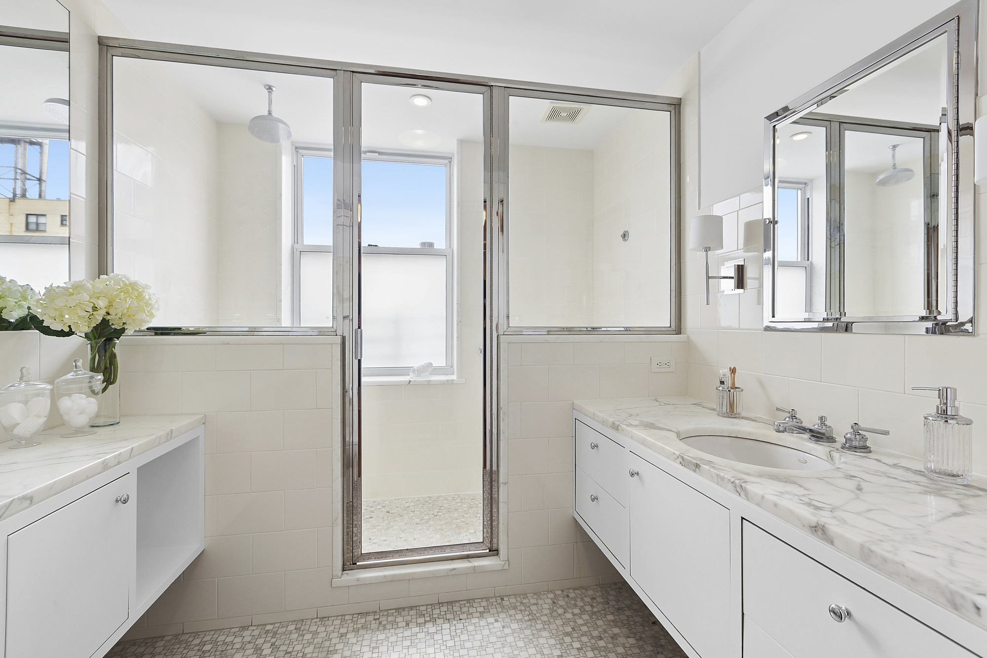 325 Riverside Drive, Unit 111 Manhattan, NY 10025 - Photo 9 of 13 a bathroom with a double vanity sink and mirror