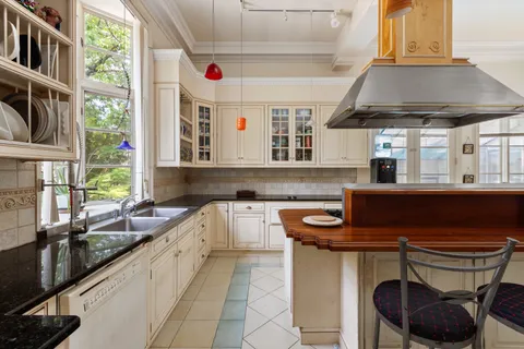 a kitchen with a sink and a stove