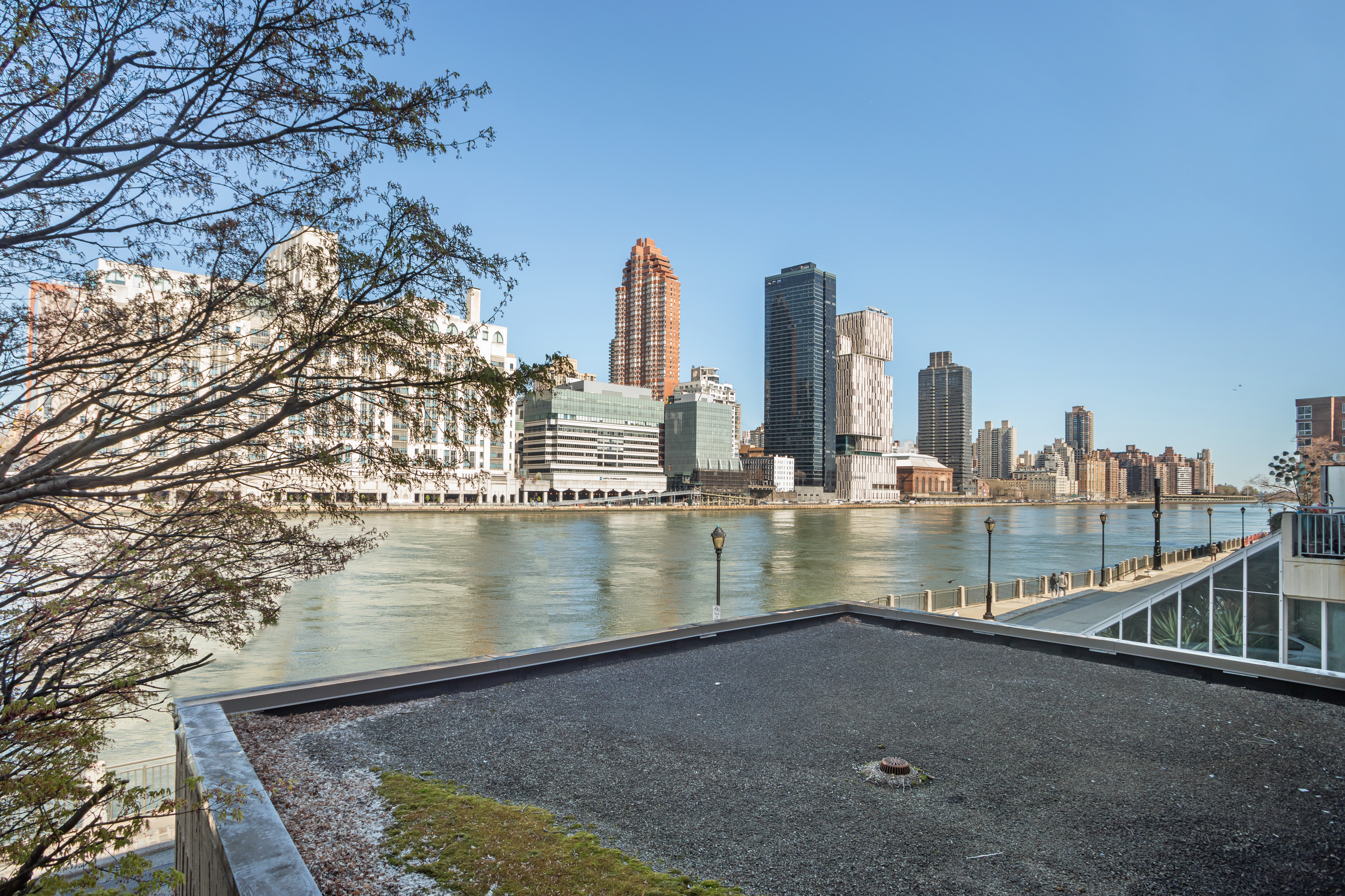 551 Main Street, Unit 208 Manhattan, NY 10044 - Photo 4 of 36 a view of swimming pool with outdoor seating and city view