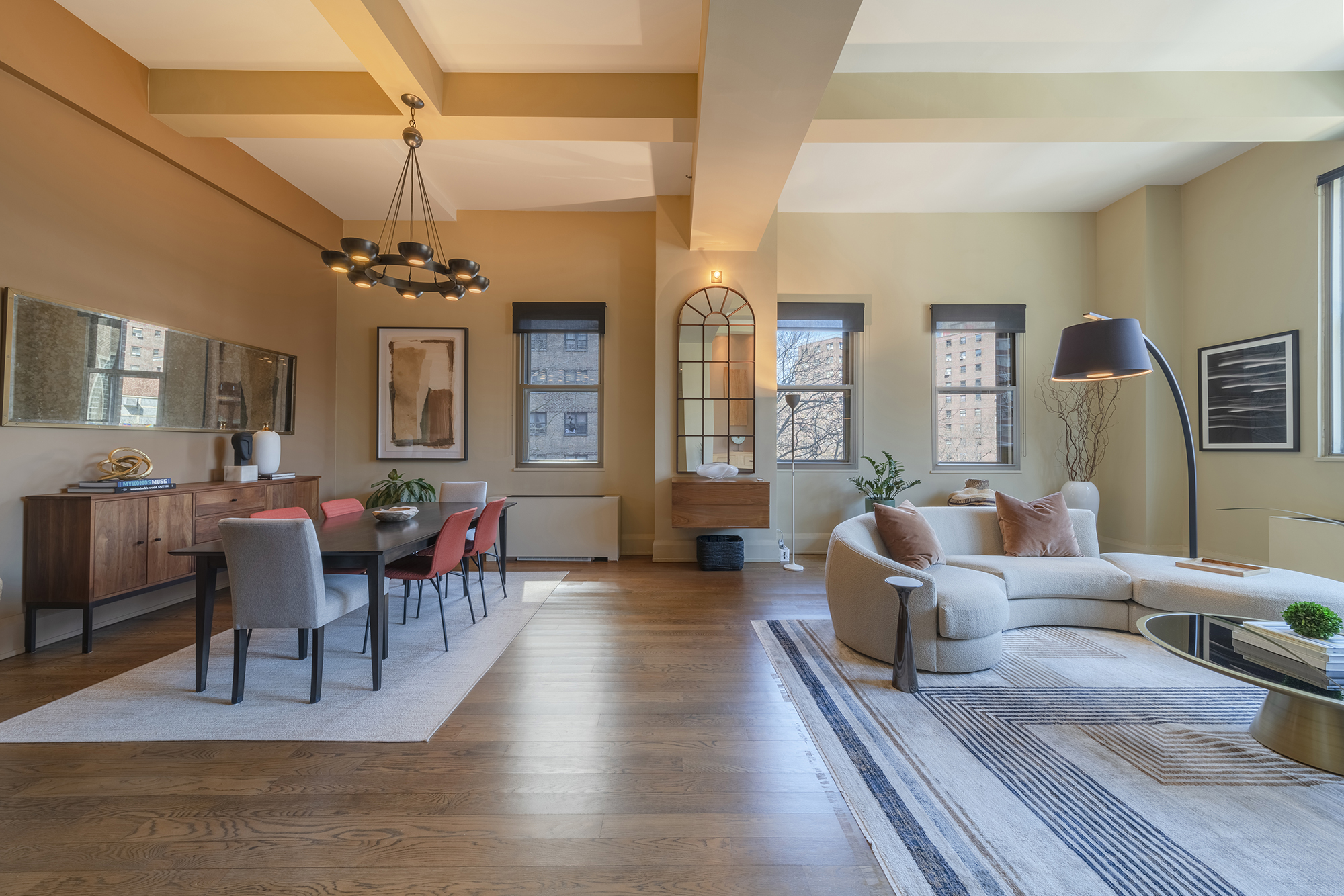 263 9th Avenue, Unit 3E Manhattan, NY 10001 - Photo 4 of 17 a living room with furniture wooden floor and a chandelier