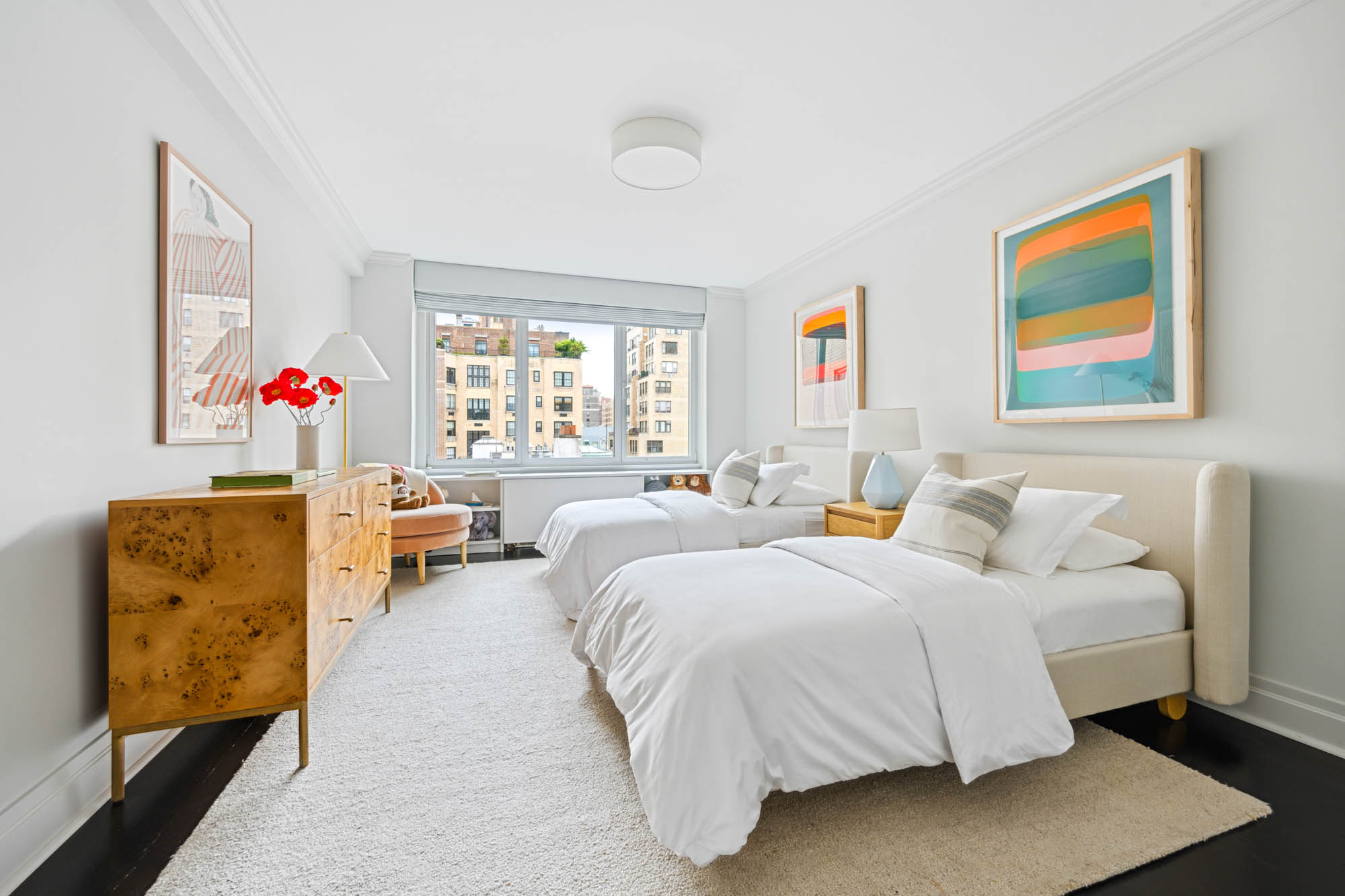 936 5th Avenue, Unit 10AB Manhattan, NY 10021 - Photo 28 of 37 a bedroom with a bed and a couch