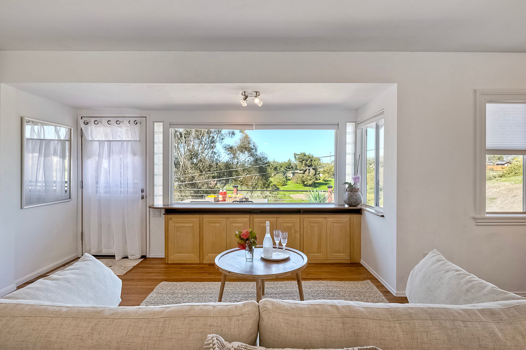 534 Hoover Street Oceanside, CA 92054 - Photo 4 of 31 a living room with furniture and a large window