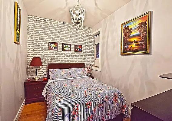 138 Edgecombe Avenue, Unit 3A Manhattan, NY 10030 - Photo 4 of 10 a bedroom with a bed and a lamp