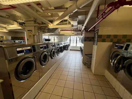 a utility room with dryer washer and other items