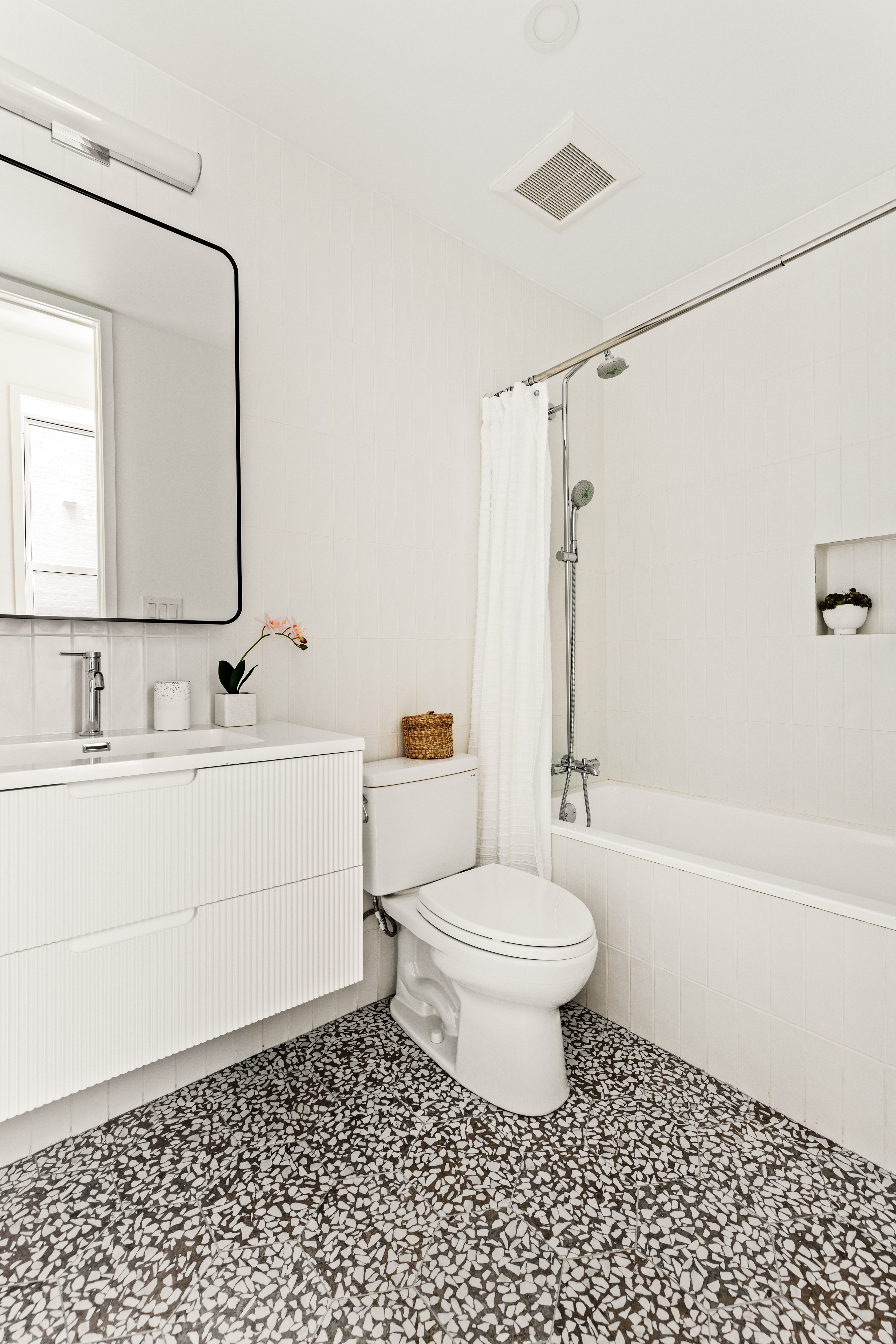 744 Park Place, Unit 2A Brooklyn, NY 11216 - Photo 8 of 11 a bathroom with a sink a toilet and a mirror