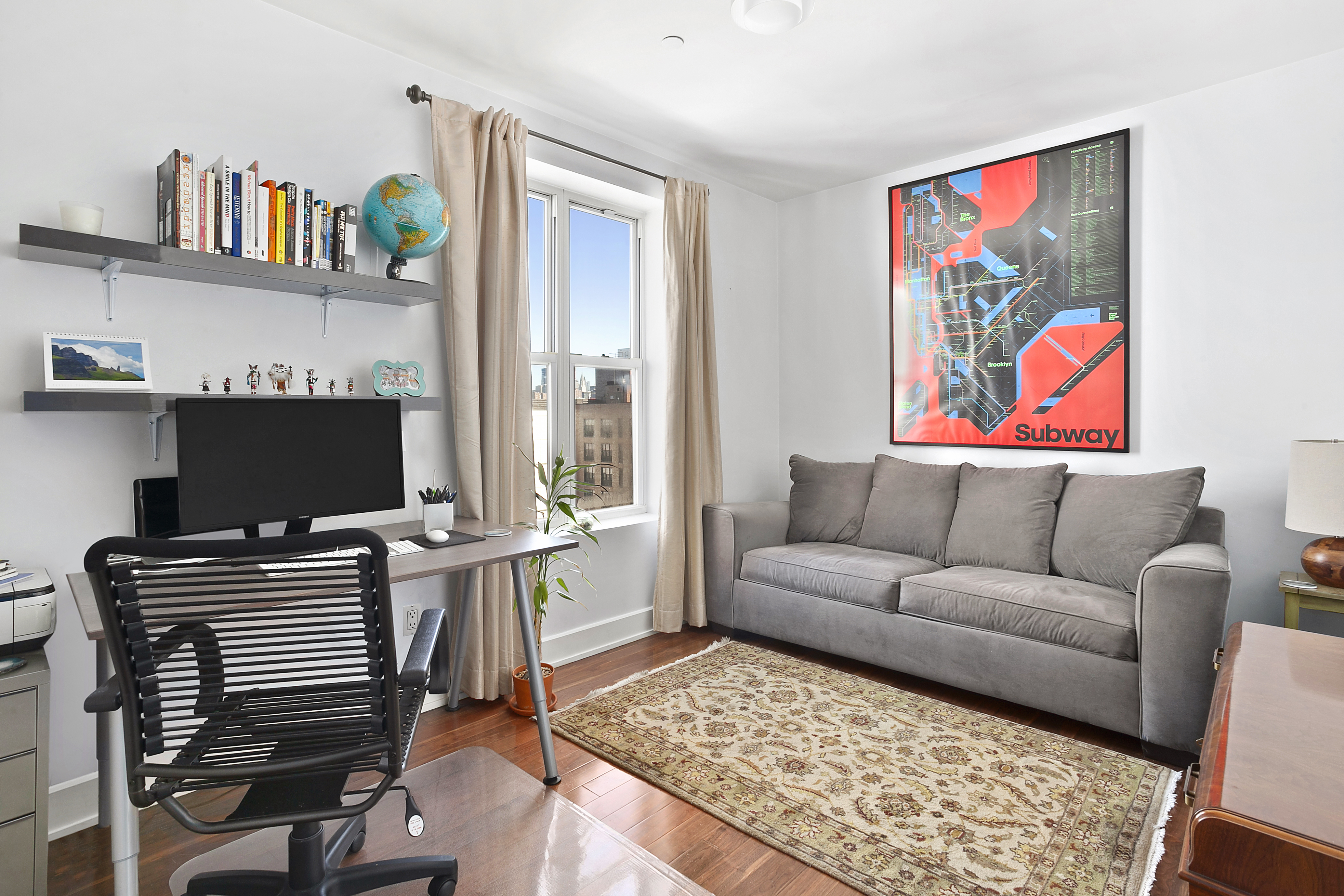 66 North 1st Street, Unit 5A Brooklyn, NY 11249 - Photo 4 of 7 a living room with furniture and a flat screen tv