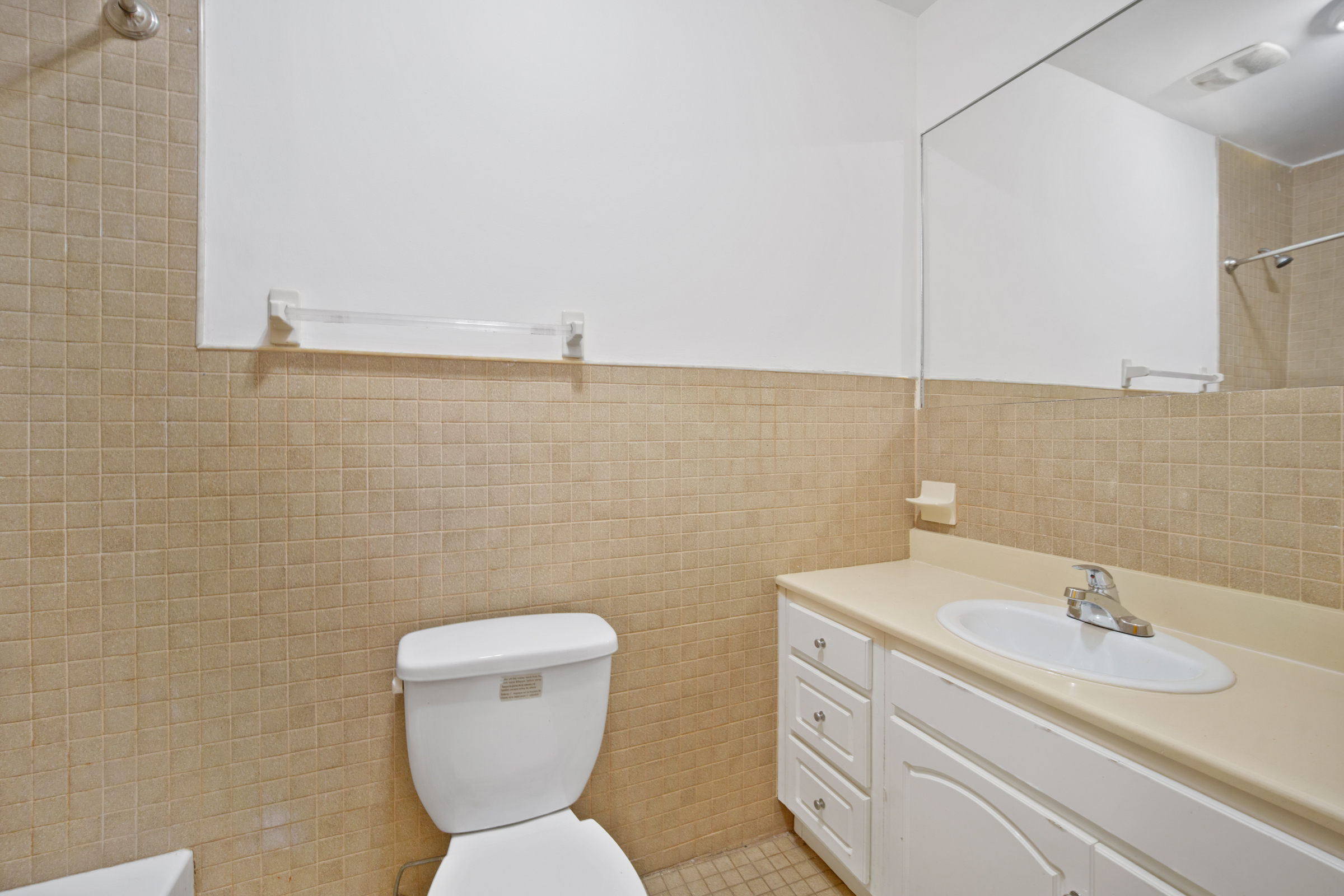 614 Eastern Parkway, Unit 2 Brooklyn, NY 11225 - Photo 6 of 6 a bathroom with a toilet sink and mirror
