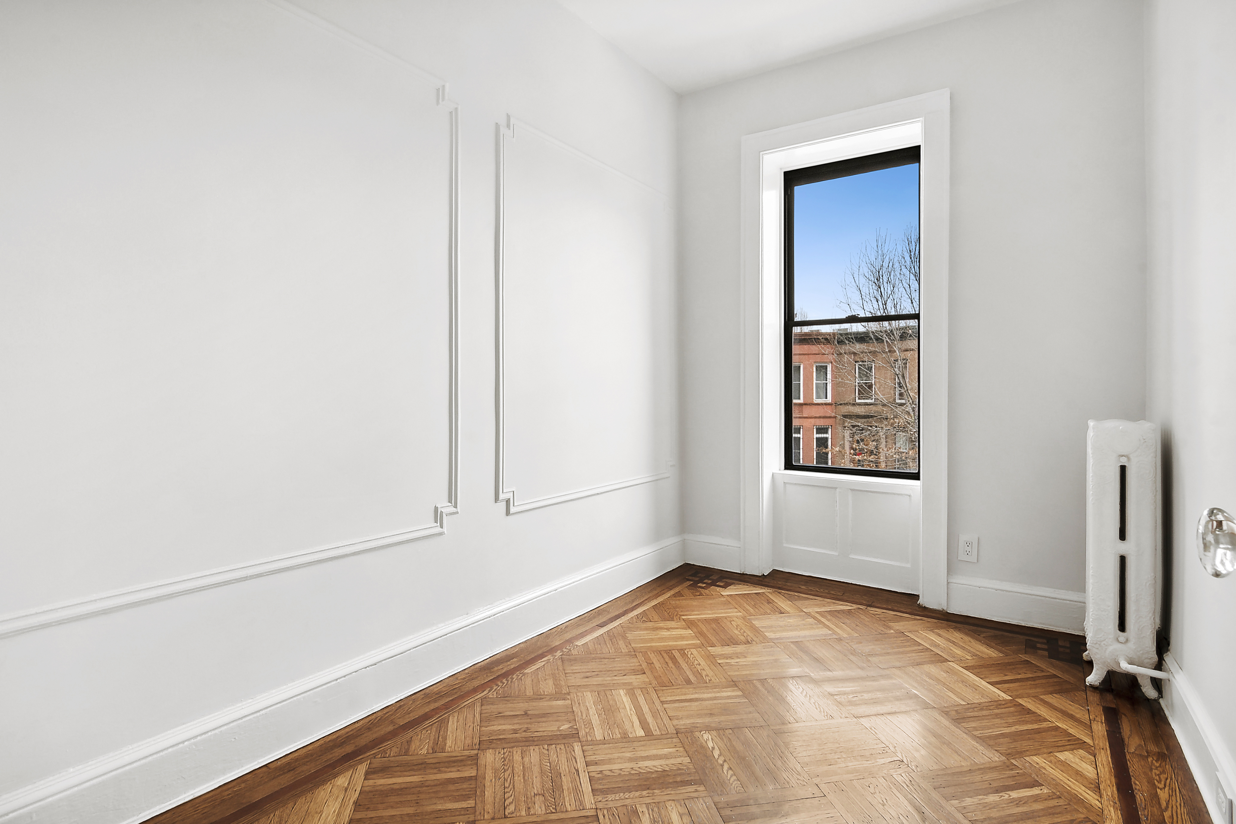 195 Rutland Road Brooklyn, NY 11225 - Photo 14 of 21 a view of an empty room and window