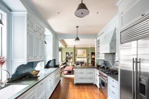 a living room with fireplace furniture and a flat screen tv
