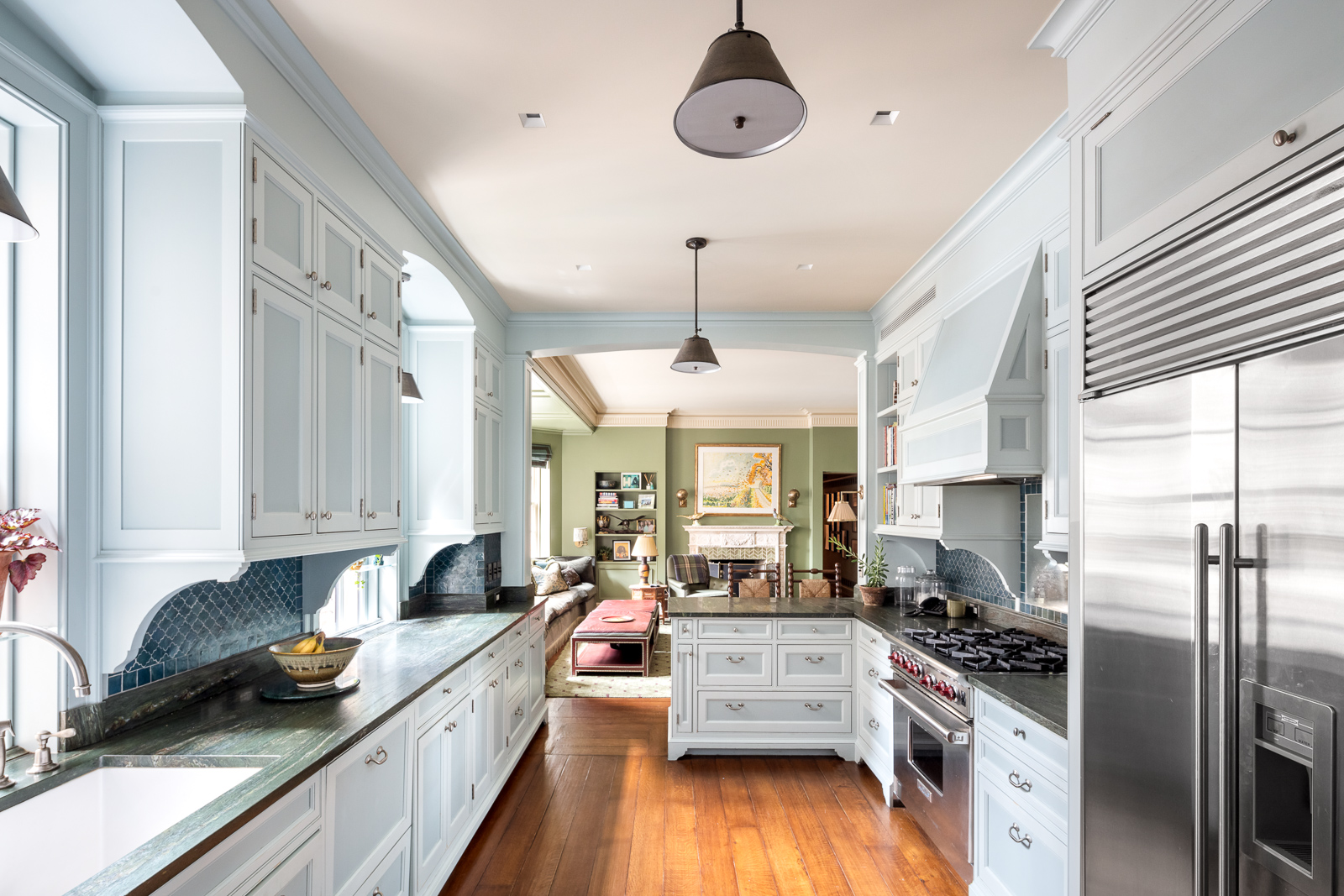 41 Central Park West, Unit 11A Manhattan, NY 10023 - Photo 12 of 17 a kitchen with stainless steel appliances granite countertop a stove a sink dishwasher a refrigerator white cabinets and wooden floor next to a window