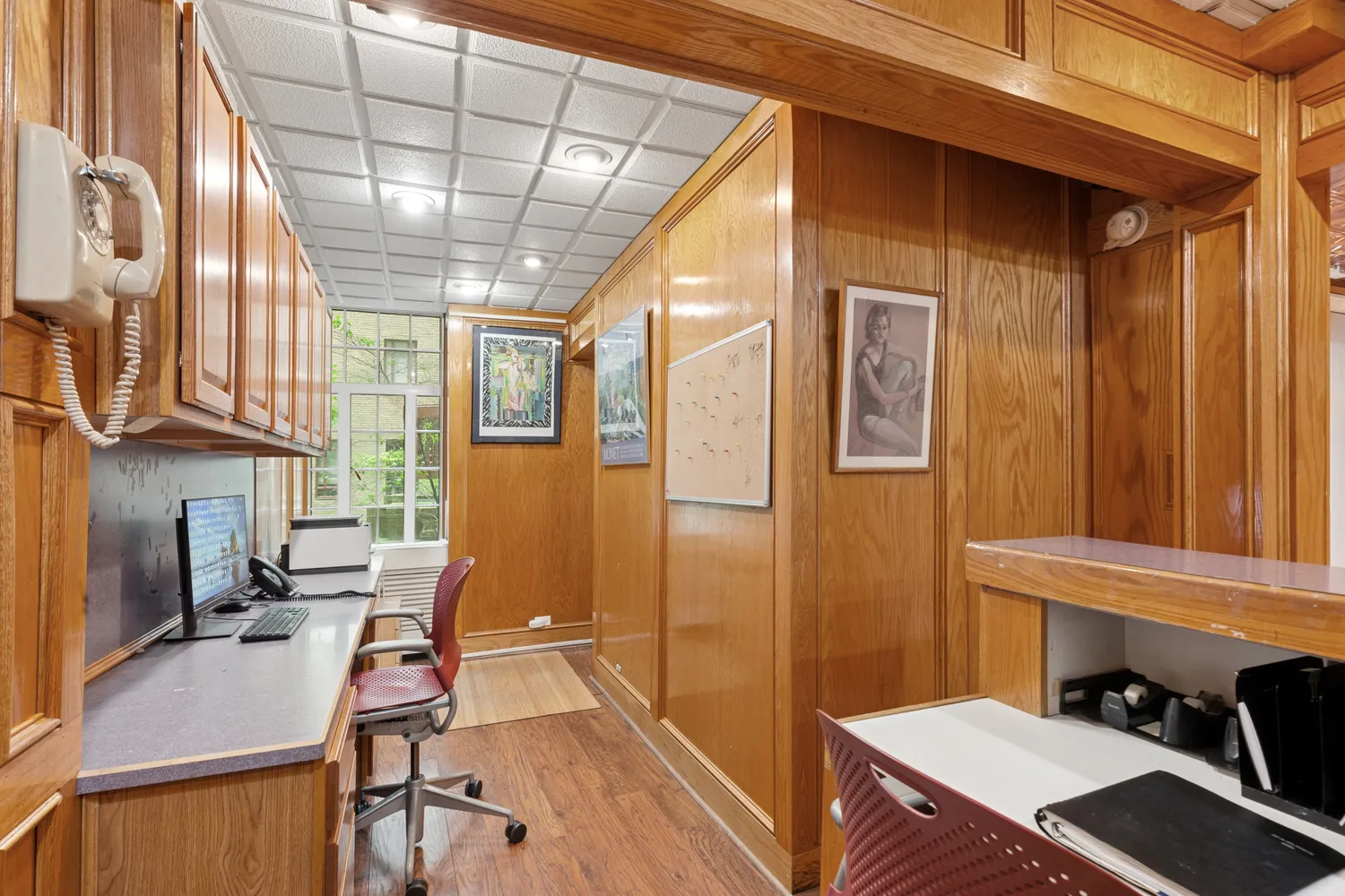 a workspace with furniture and a window