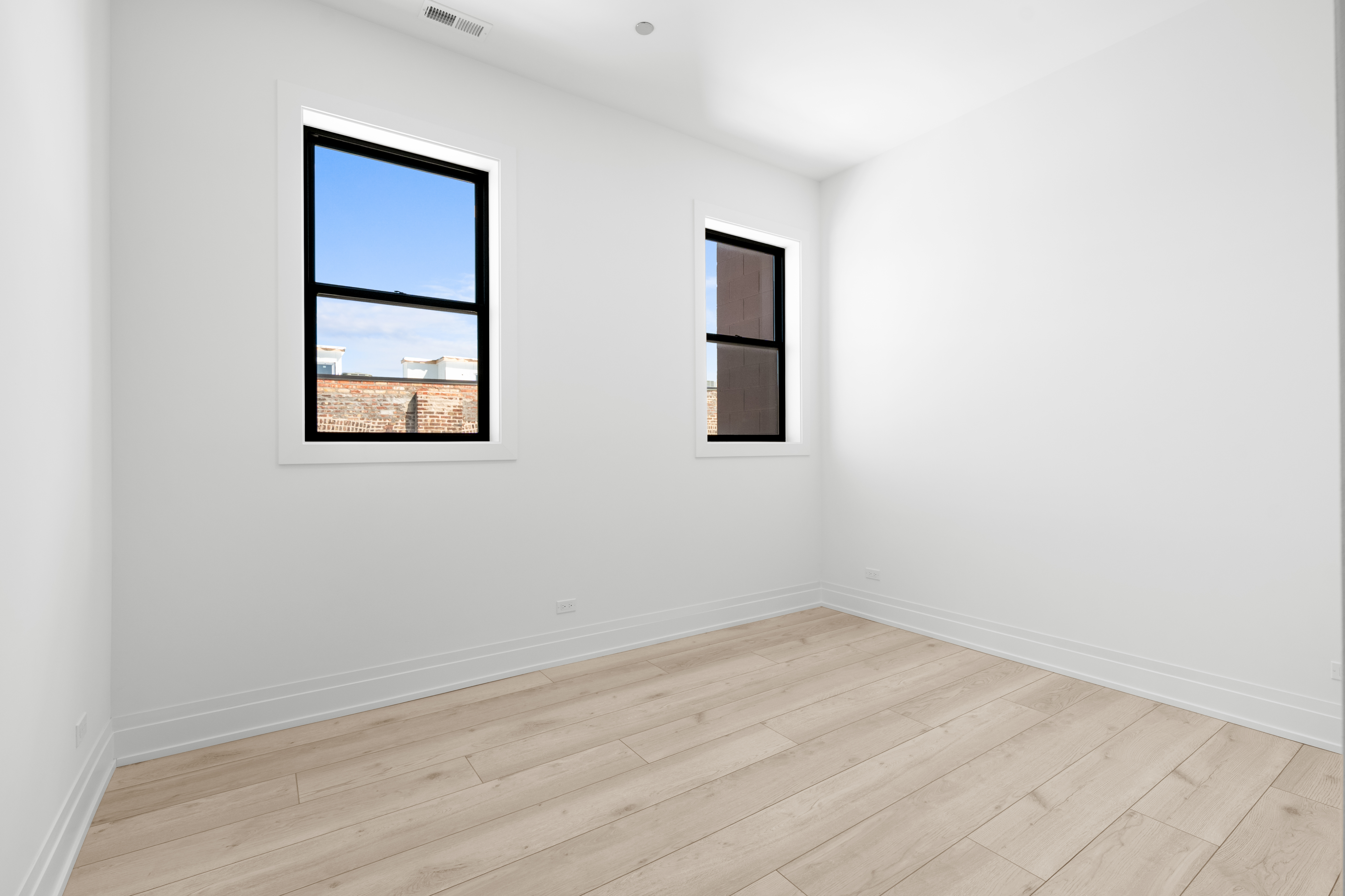1327 West Taylor Street, Unit 4 Chicago, IL 60607 - Photo 10 of 27 an empty room with windows