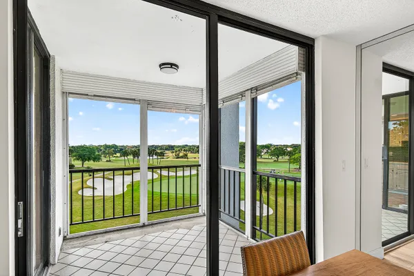 a view of a balcony with floor to ceiling window