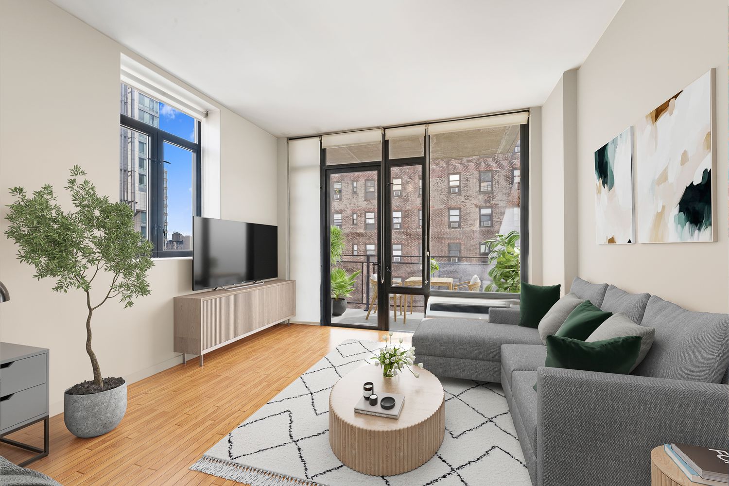 a living room with furniture and a potted plant