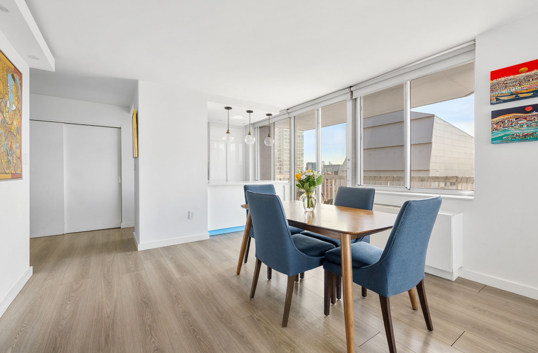 50 Lexington Avenue, Unit 25E Manhattan, NY 10010 - Photo 3 of 13 a view of a dining room with furniture and wooden floor
