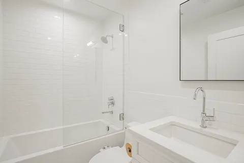 a view of a room with gym equipment and windows