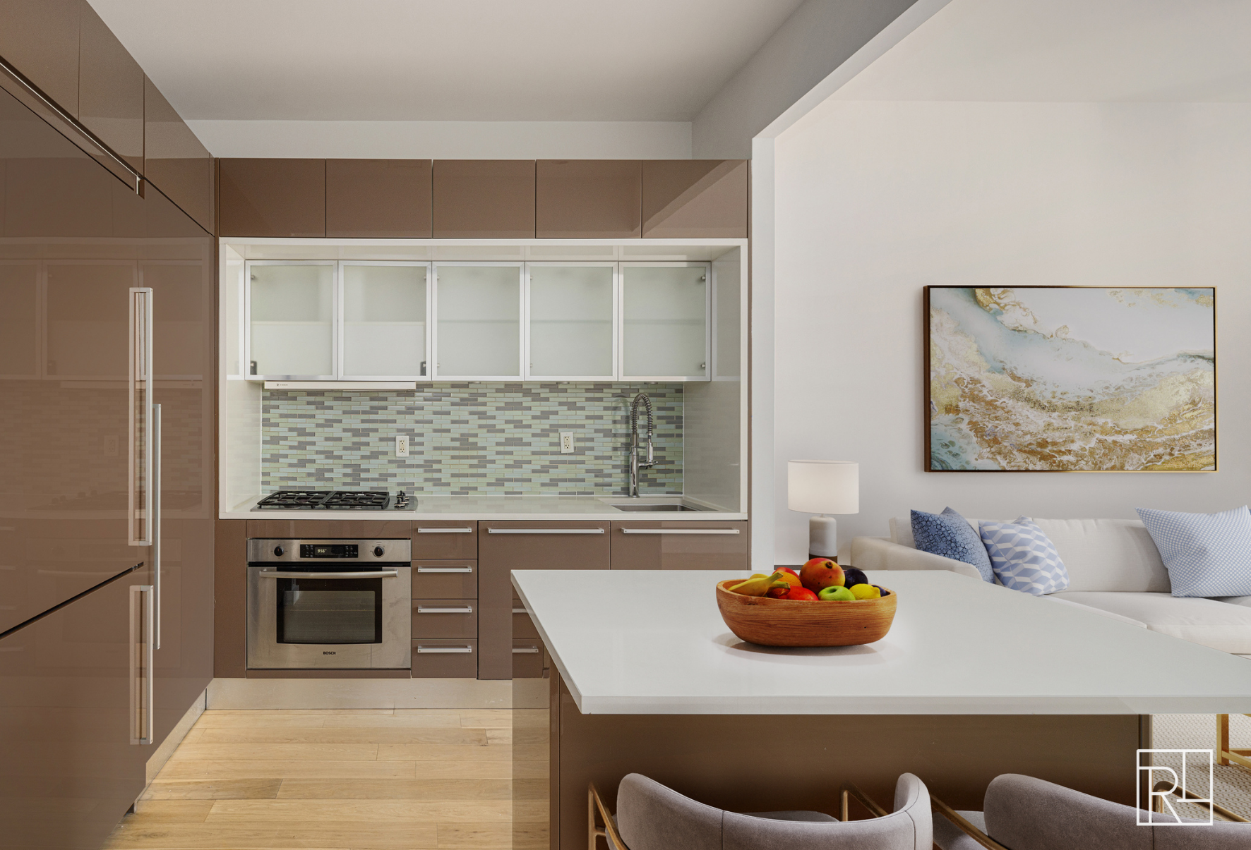 75 Wall Street, Unit 28D Manhattan, NY 10005 - Photo 7 of 35 a view of a kitchen area with furniture and stainless steel appliances