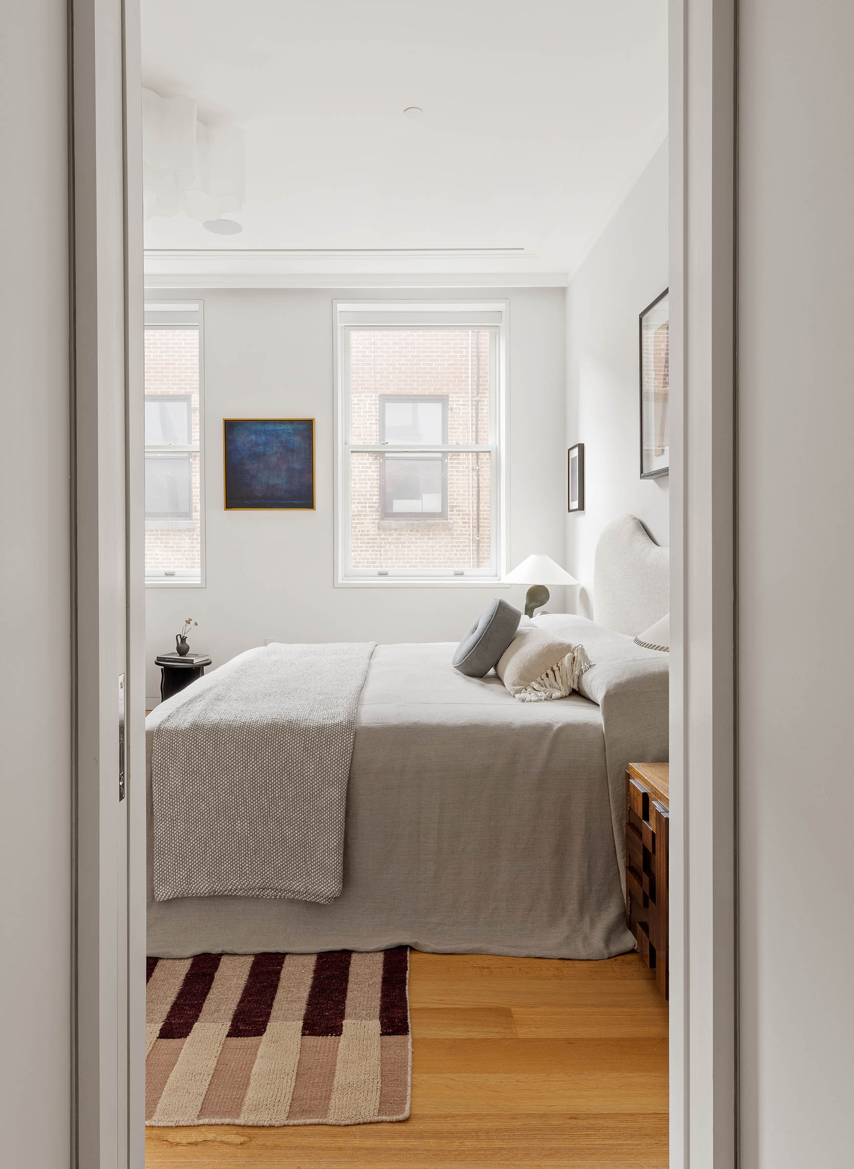 7 Harrison Street, Unit 5S Manhattan, NY 10013 - Photo 14 of 21 a bedroom with a bed and a window