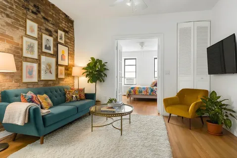 a living room with furniture or couch and a flat screen tv