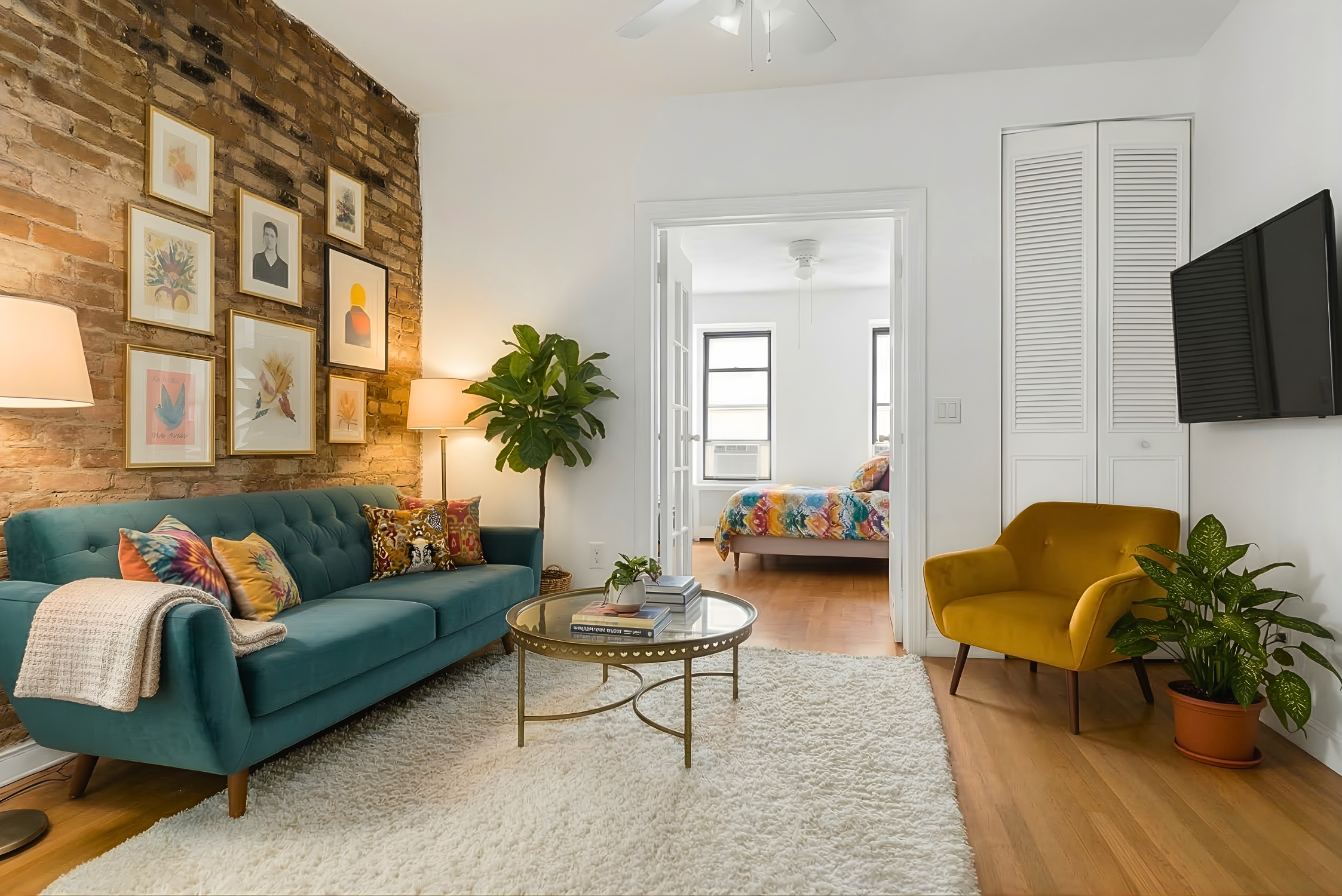 215 East 88th Street, Unit 4A Manhattan, NY 10128 - Photo 3 of 11 a living room with furniture or couch and a flat screen tv