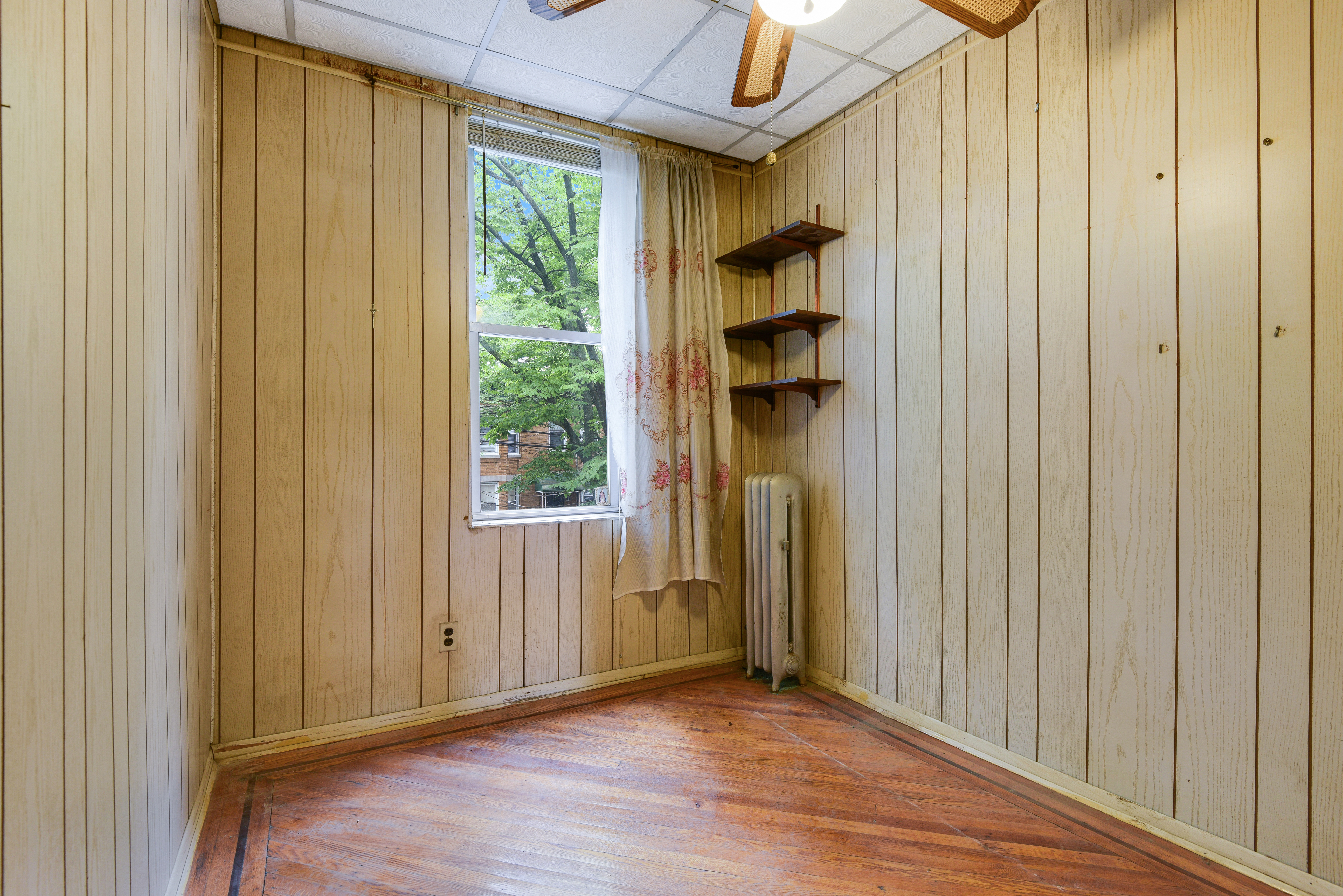 75-36 60th Lane Queens, NY 11385 - Photo 10 of 18 a view of a bathroom with wooden floor and a window