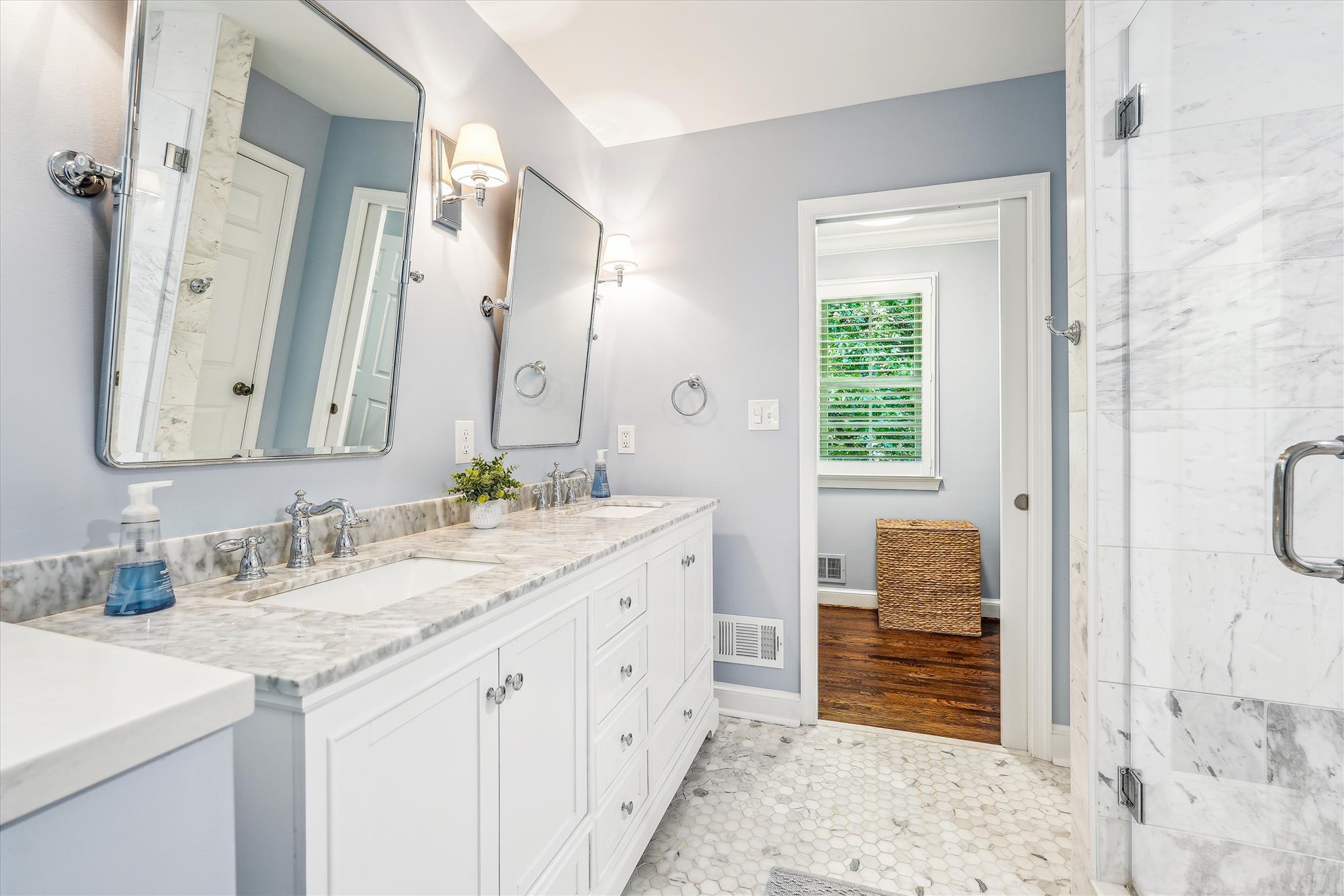 9904 Carter Road Bethesda, MD 20817 - Photo 22 of 41 a spacious bathroom with a granite countertop sink and a mirror